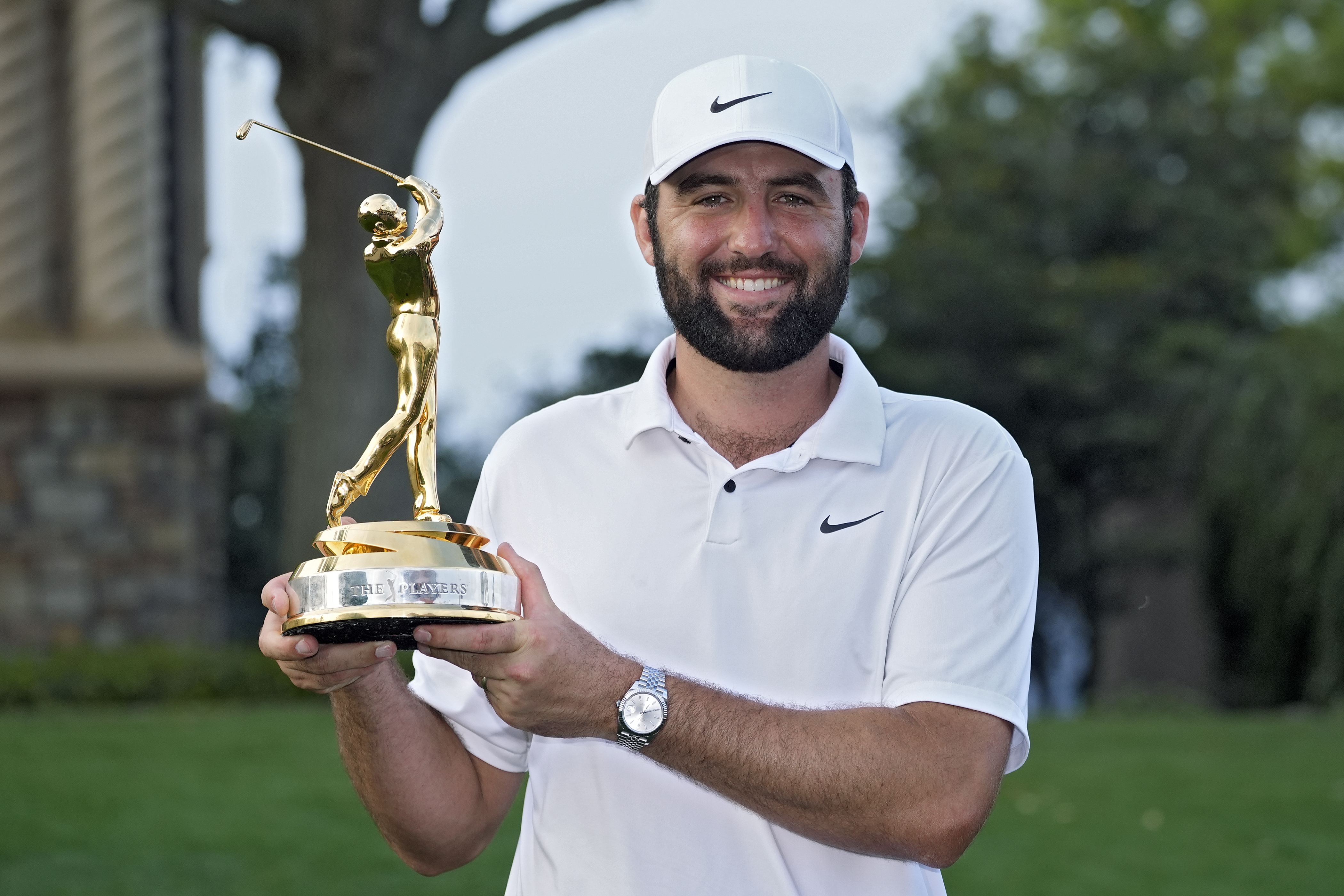 Scottie Scheffler holds the trophy after winning The Players Championship golf tournament in Ponte Vedra Beach, Florida, US.