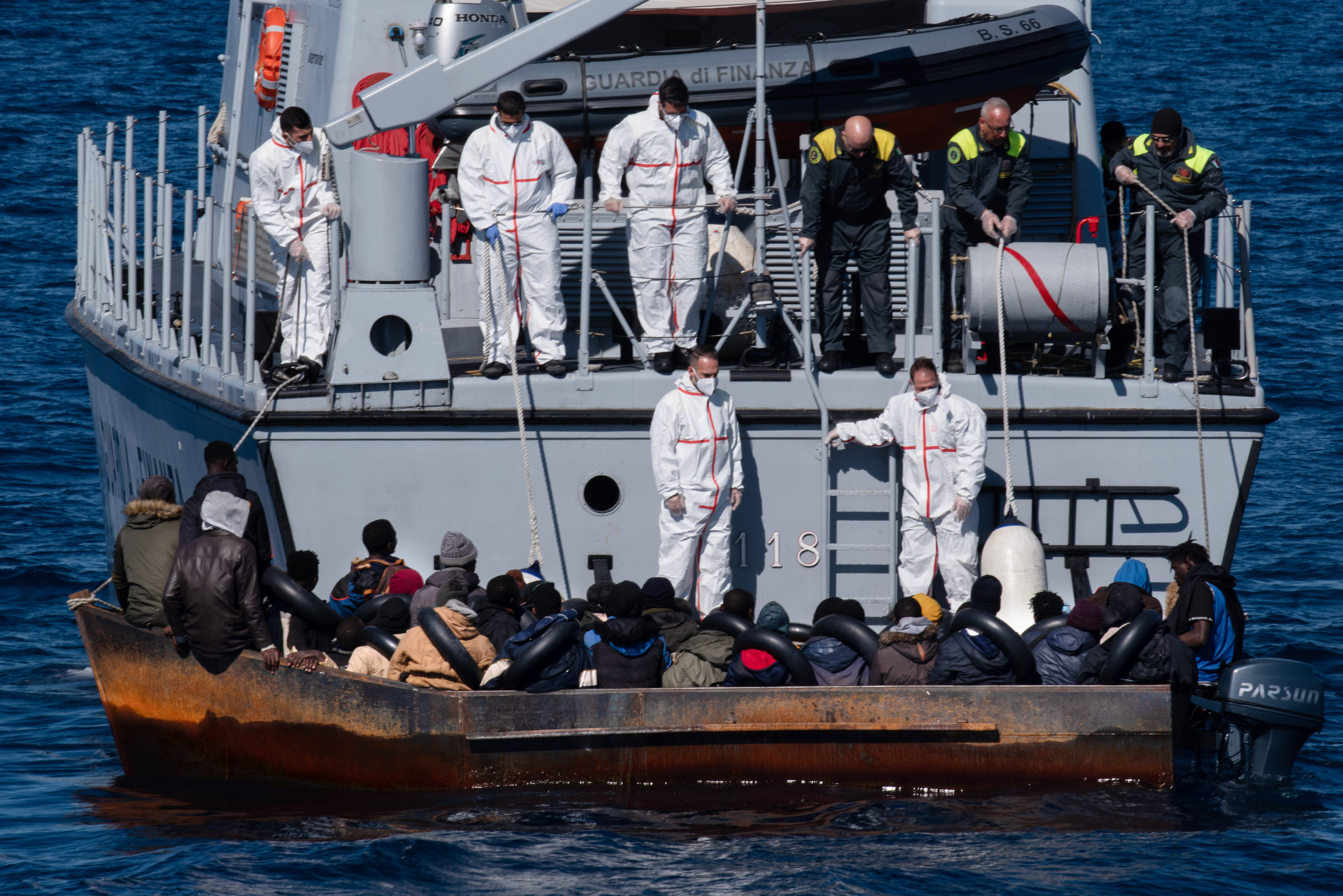 The crew of a Guardia di Finanza boat rescues about 45 refugees off the coast of Lampedusa, Italy, on February 21, 2023. There were 20 minors on board, 18 of whom were not accompanied by adults [Ximena Borrazas/SOPA Images/LightRocket via Getty Images]