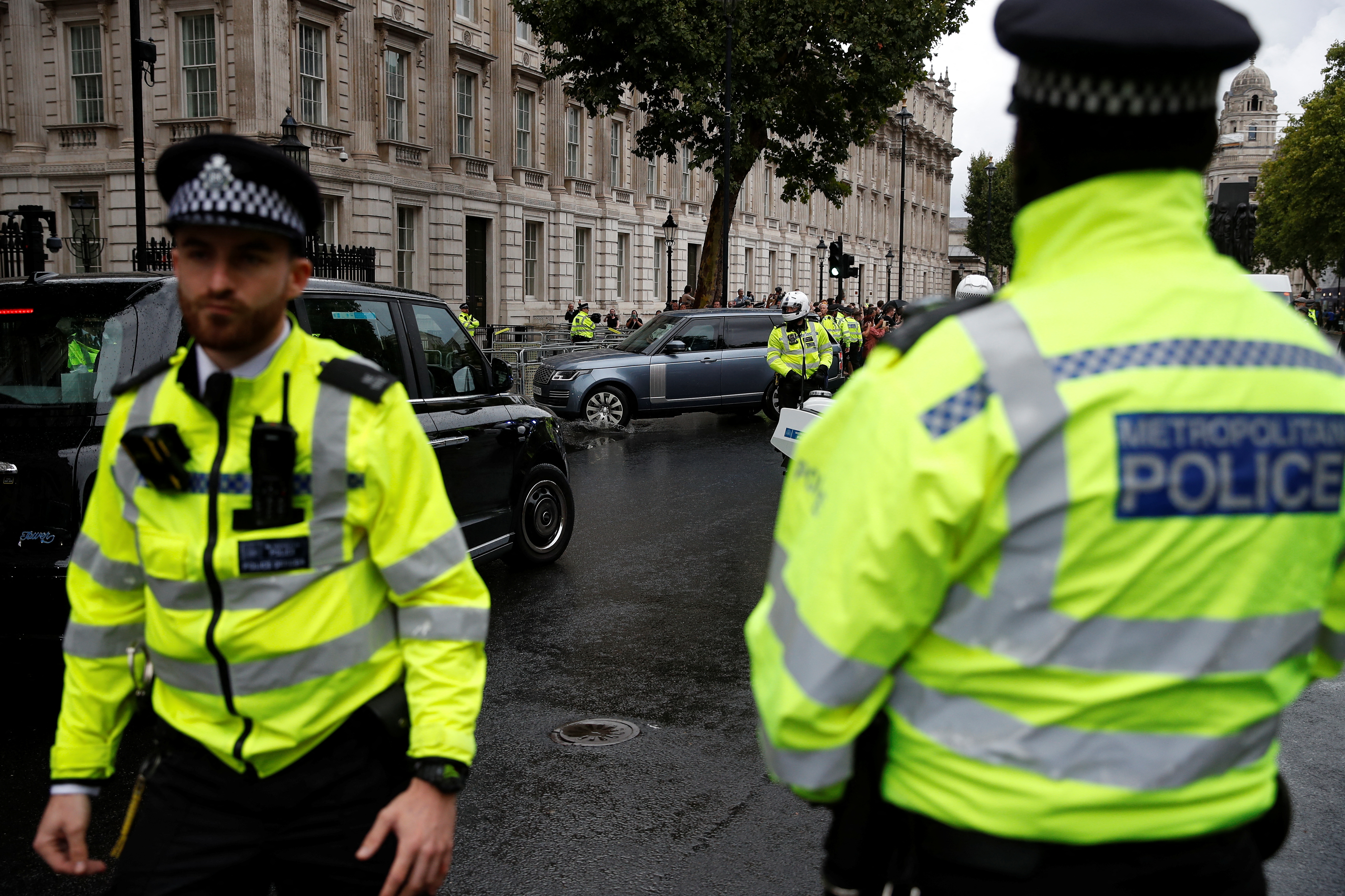 Police officers stand guard as new British Prime Minister Liz Truss's car arrives at Downing Street, in London, Britain September 6, 2022. REUTERS/Peter Nicholls