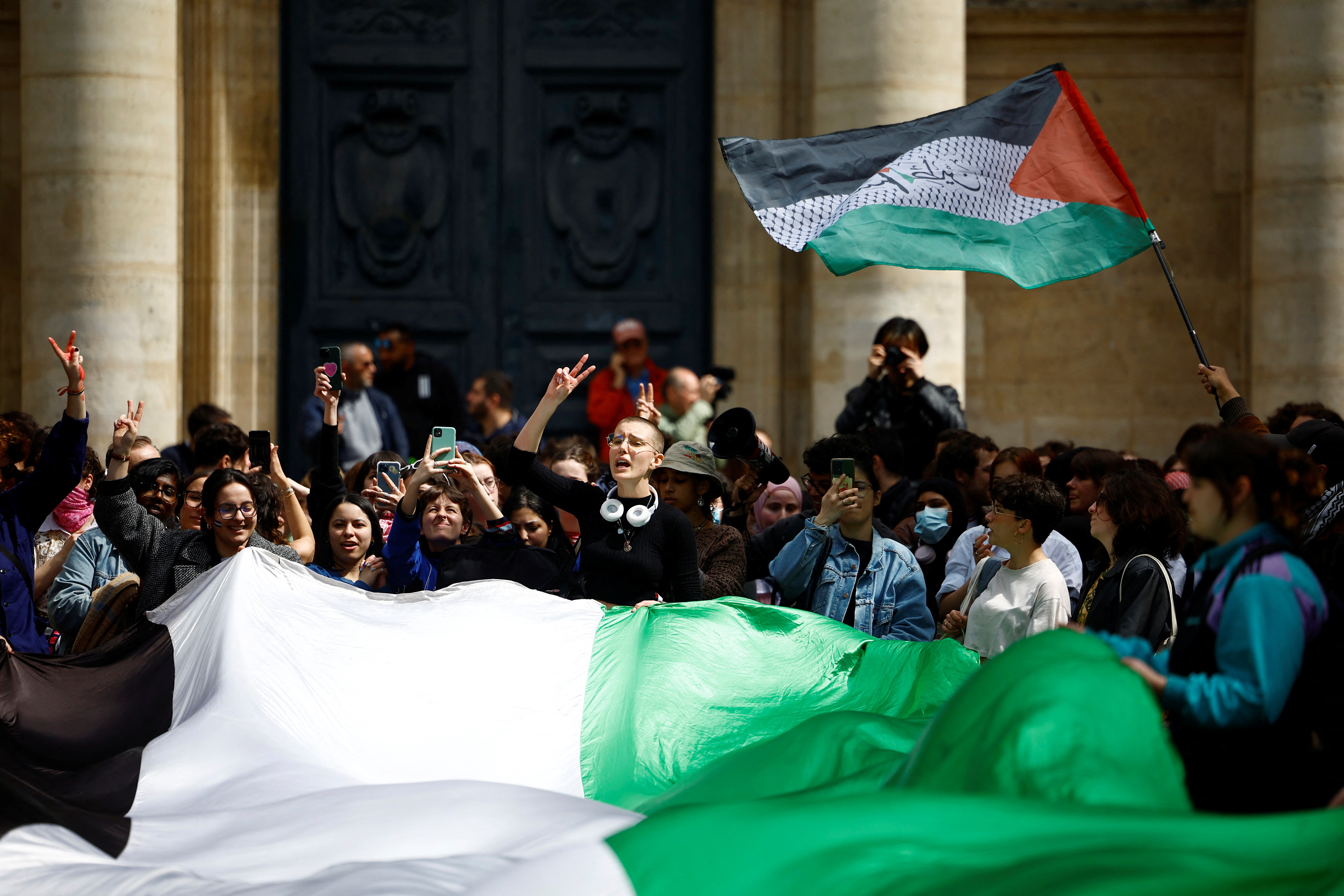 Students hold Palestinian flags as they gather in front of the Sorbonne University in support of Palestinians in Gaza, during the ongoing conflict between Israel and the Palestinian Islamist group Hamas, in Paris, France, April 29, 2024. REUTERS/Sarah Meyssonnier (Reuters)