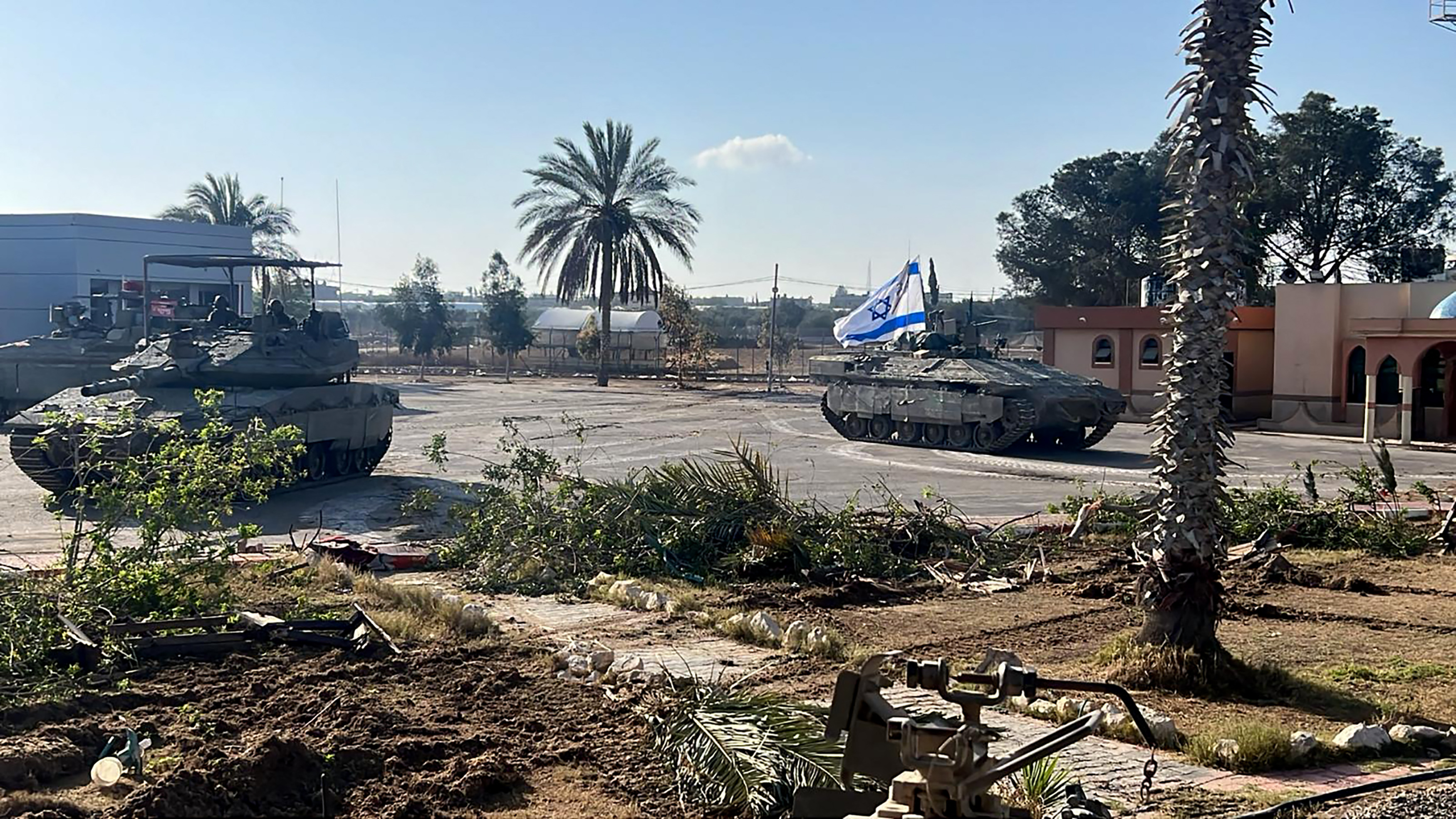 Israeli tanks entering the Palestinian side of the Rafah border crossing between Gaza and Egypt on May 7, 2024