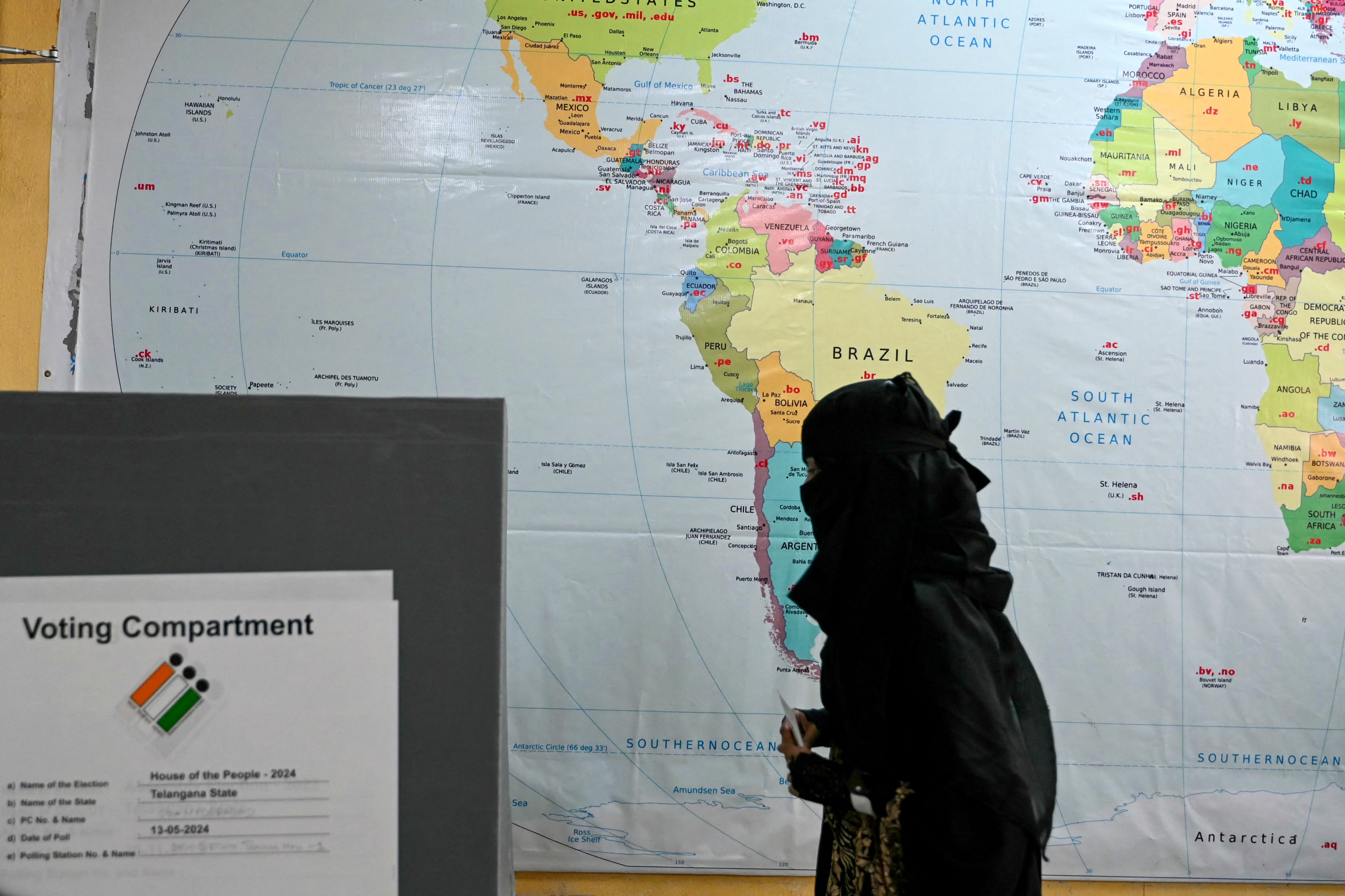 A Muslim woman arrives to cast her ballot at a polling station during the fourth phase of voting in Indias general election, in Hyderabad on May 13, 2024.