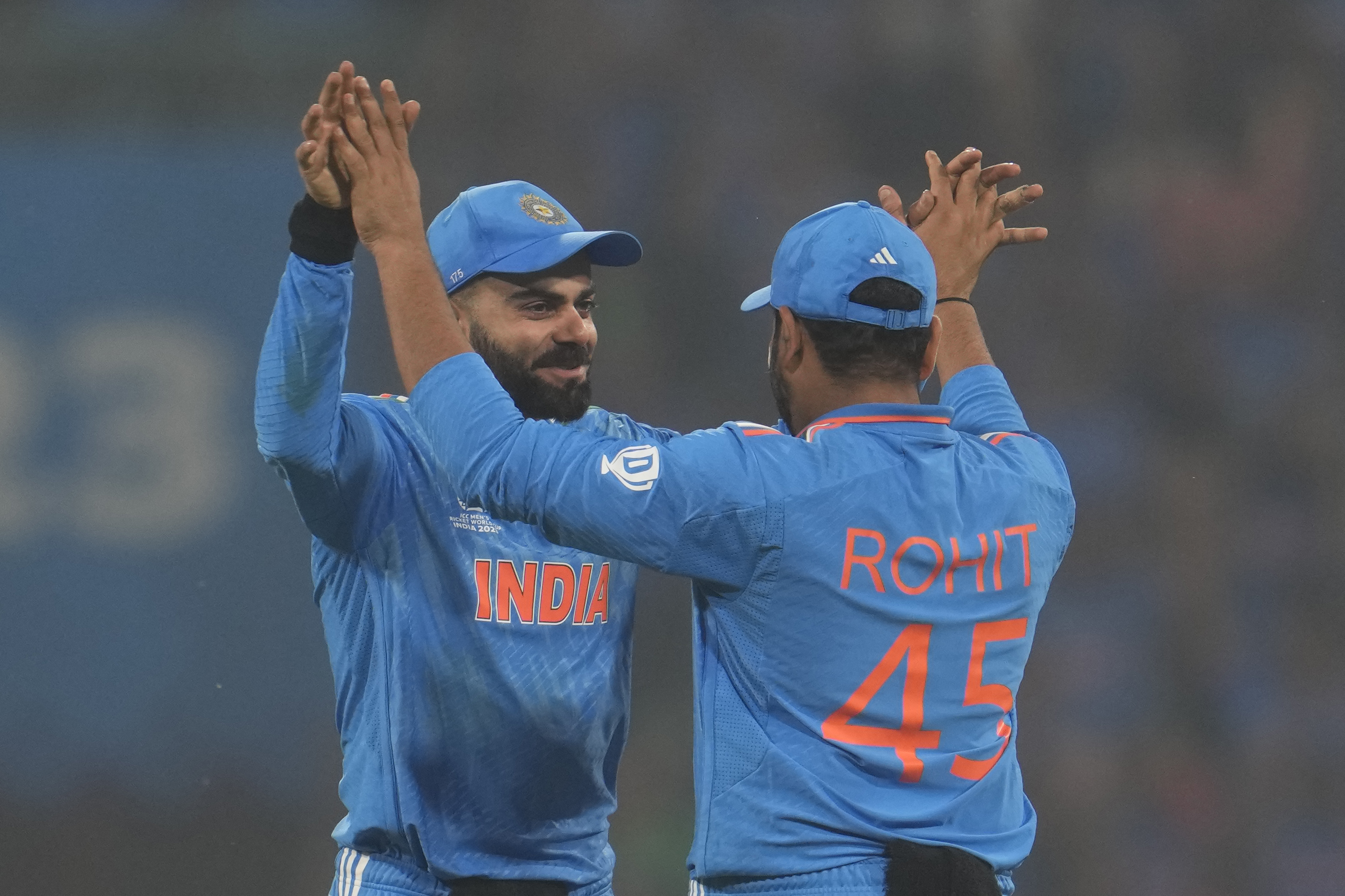 India's captain Rohit Sharma, right, greet India's Virat Kohli after India won their ICC Men's Cricket World Cup match against England in Lucknow, India, Sunday, Oct. 29, 2023.(AP Photo/Manish Swarup)