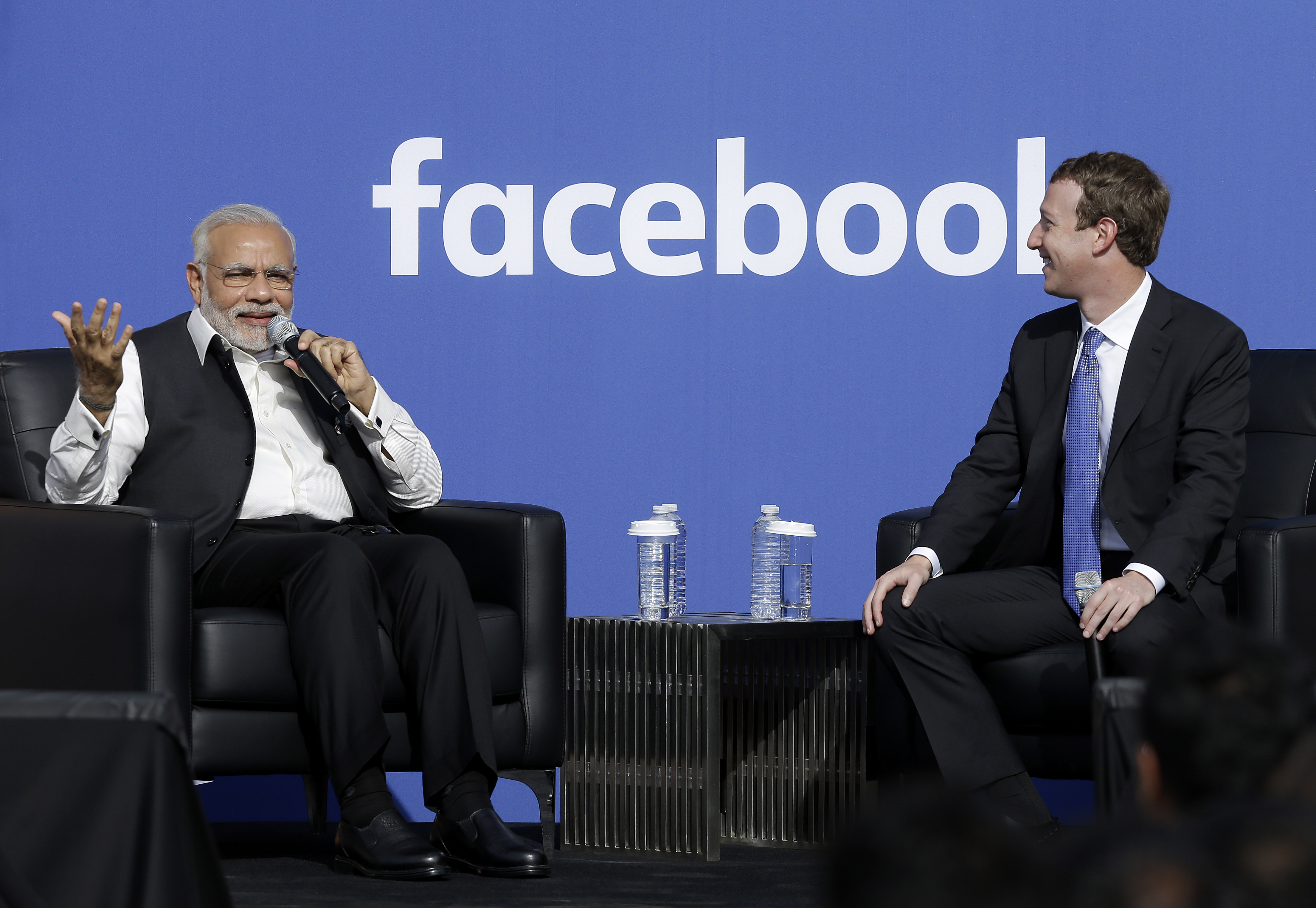 Prime Minister of India Narendra Modi, left, speaks next to Facebook CEO Mark Zuckerberg at Facebook in Menlo Park, Calif., Sunday, Sept. 27, 2015. A rare visit by Indian Prime Minister Narendra Modi this weekend has captivated his extensive fan club in the area and commanded the attention of major U.S. technology companies eager to extend their reach into a promising overseas market. (AP Photo/Jeff Chiu)