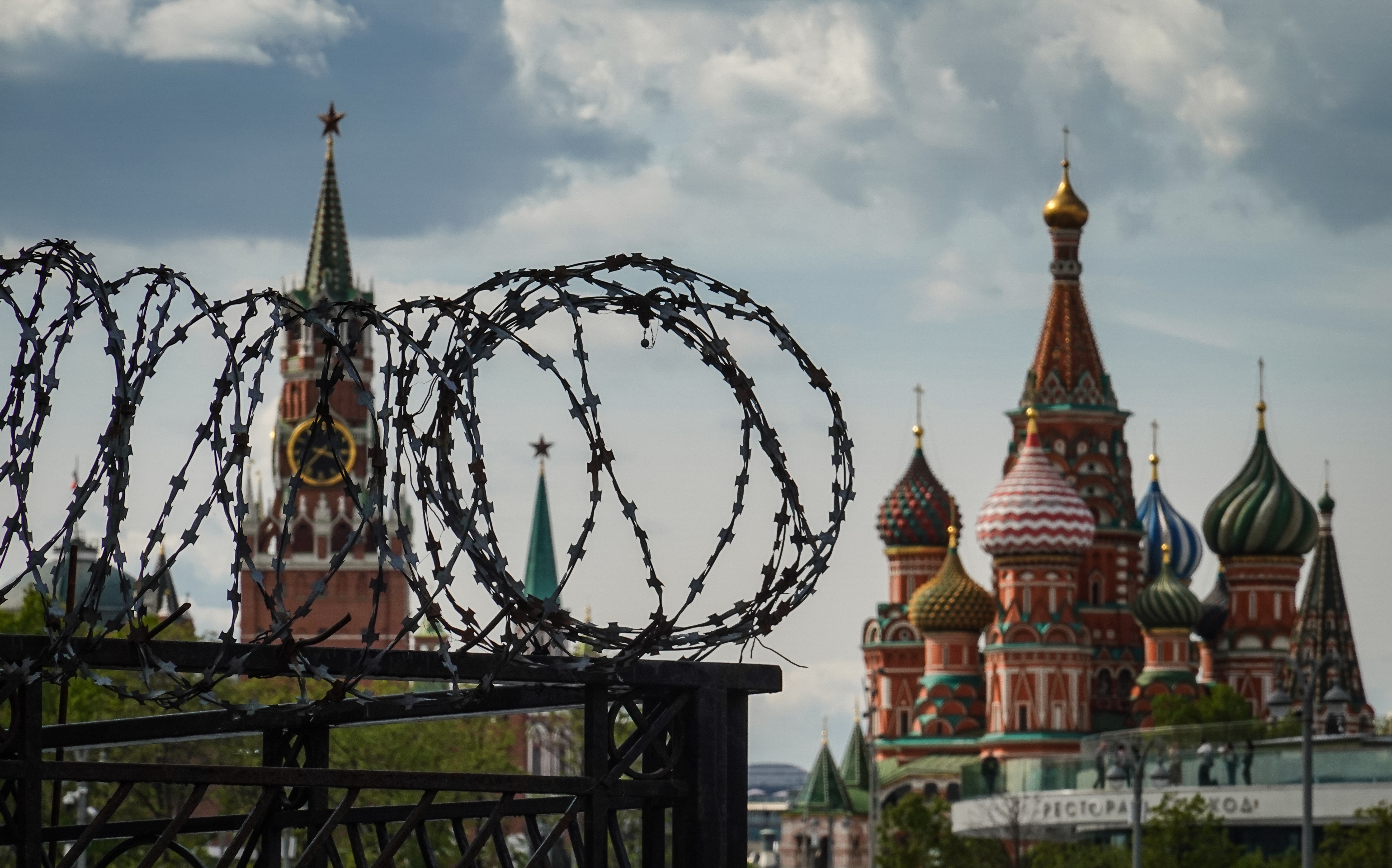 Barbed wire with the Kremlin and St Basil's Cathedral in the background