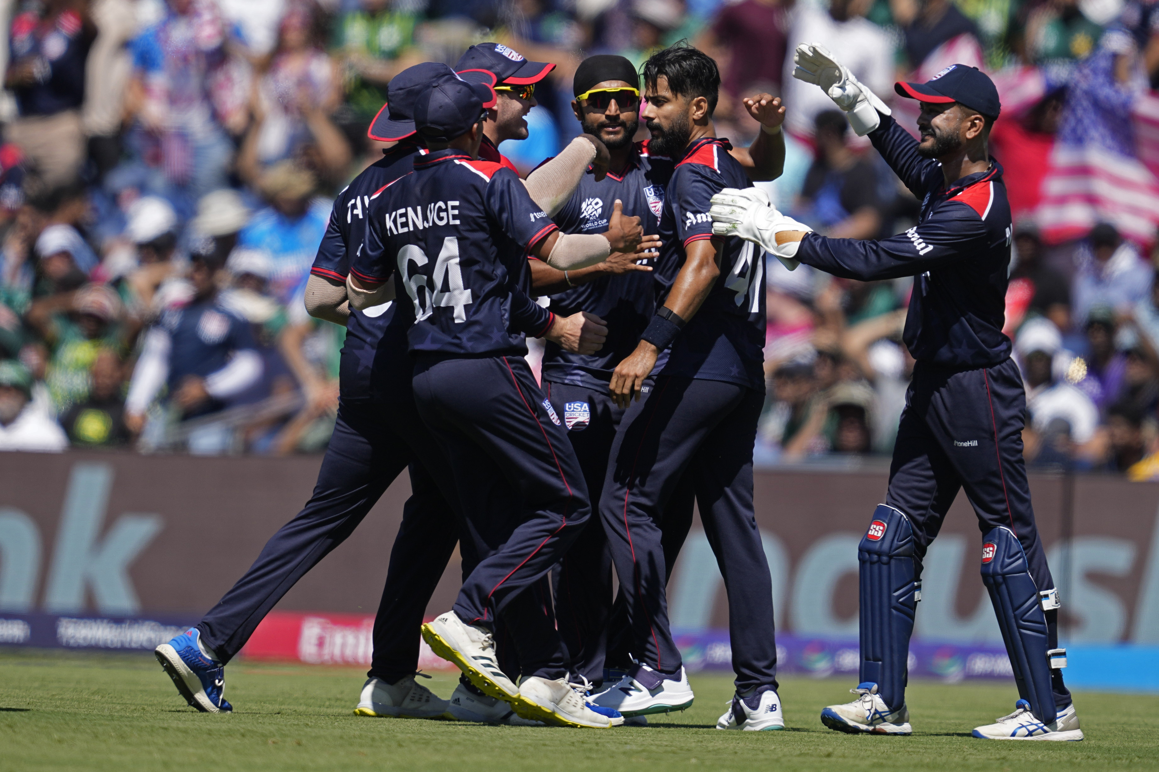 United States' Muhammad Ali-Khan, second right, celebrates with teammates after the dismissal of Pakistan's Fakhar Zaman during the ICC Men's T20 World Cup cricket match between United States and Pakistan at the Grand Prairie Stadium in Grand Prairie, Texas, Thursday, June 6, 2024. (AP Photo/Tony Gutierrez)