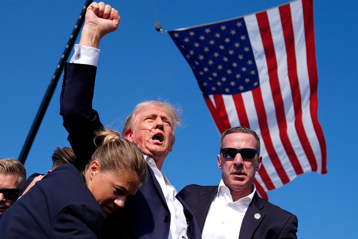 Republican presidential candidate former President Donald Trump is surrounded by U.S. Secret Service agents