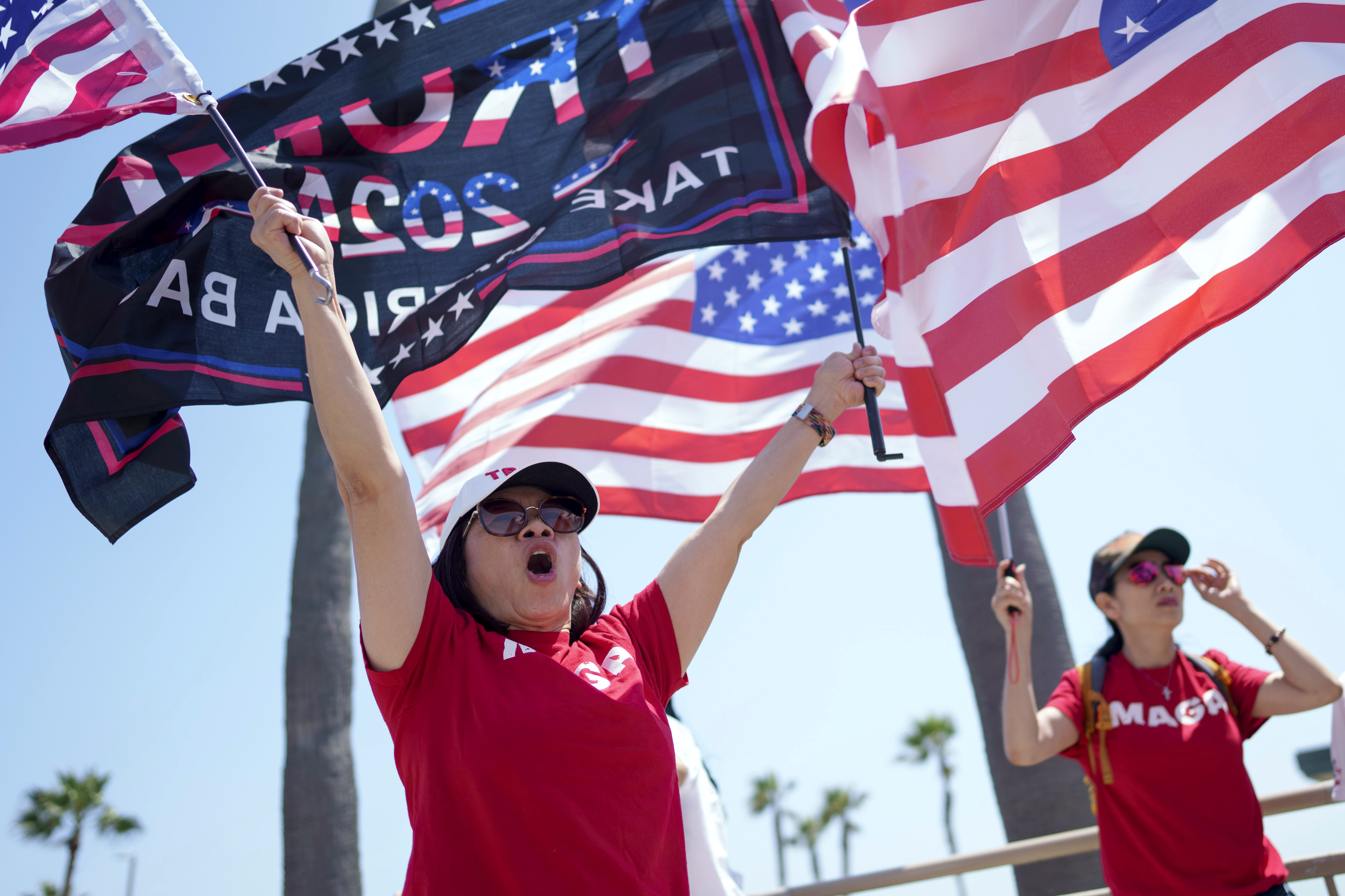 People rally in support of former President and Republican presidential candidate Donald Trump in Huntington Beach, California