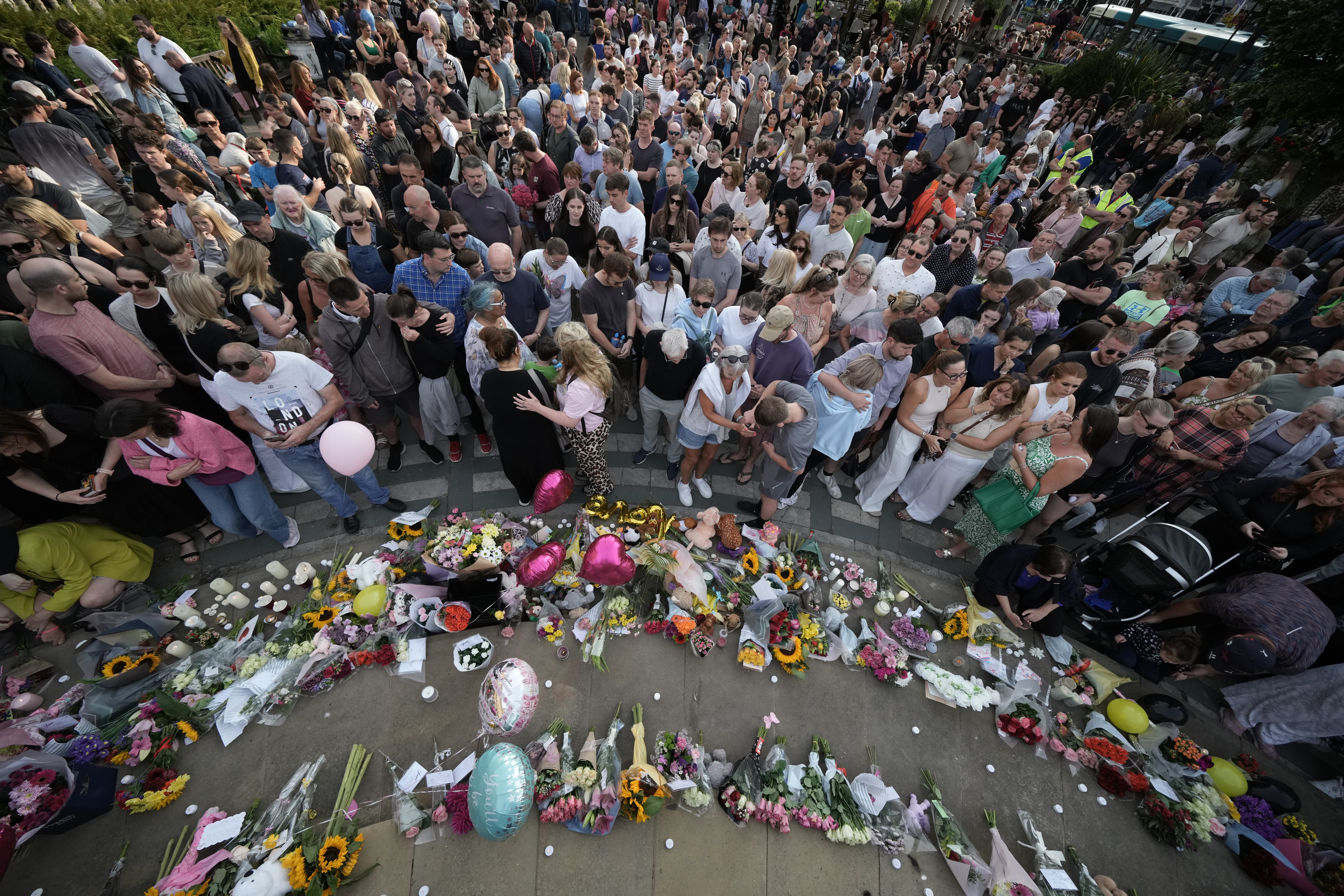 People attend a vigil.