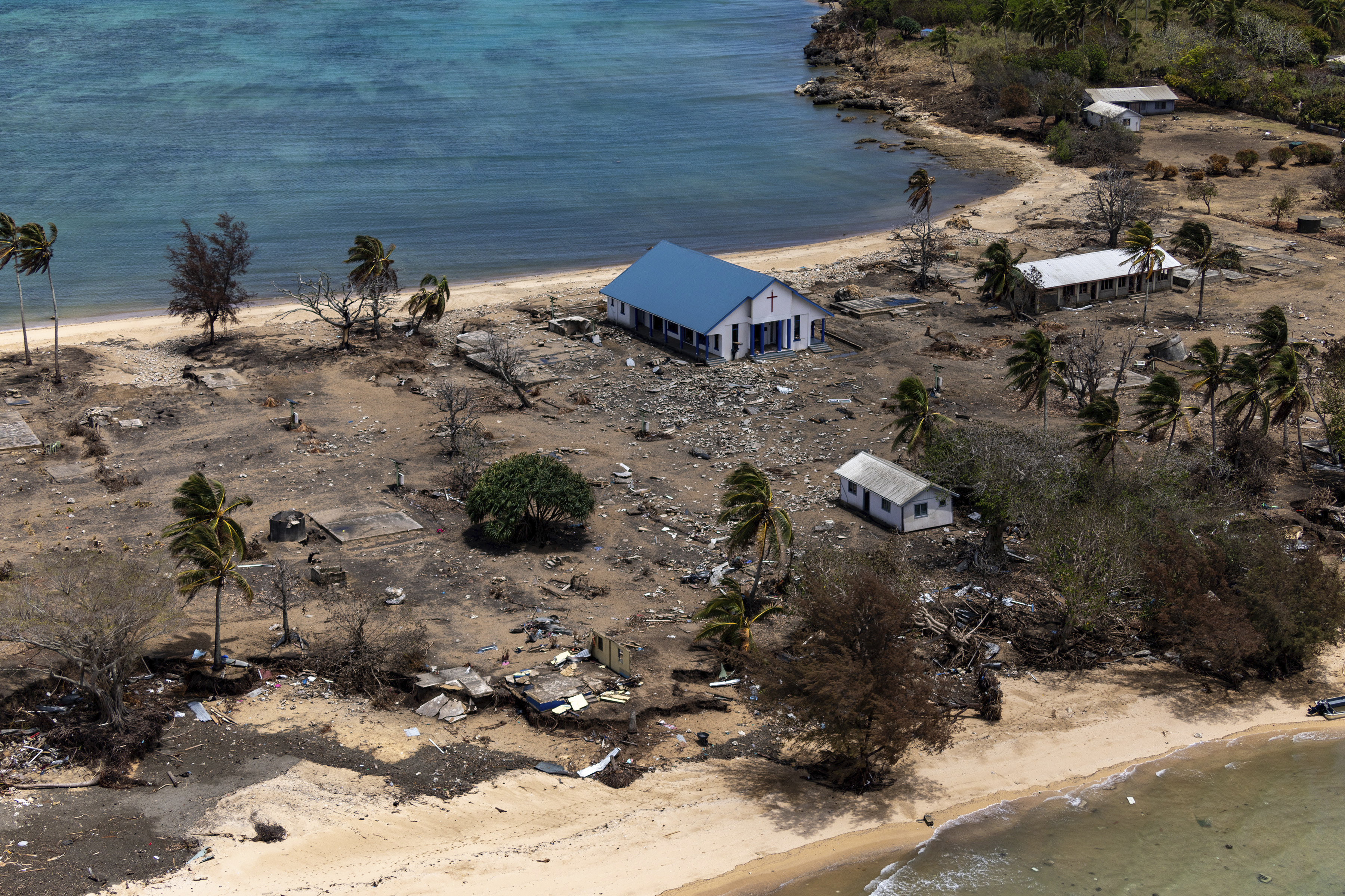 An aerial view of devastation caused to Atata island in Tonga by a tsunami triggered by the eruption of an underground volcano