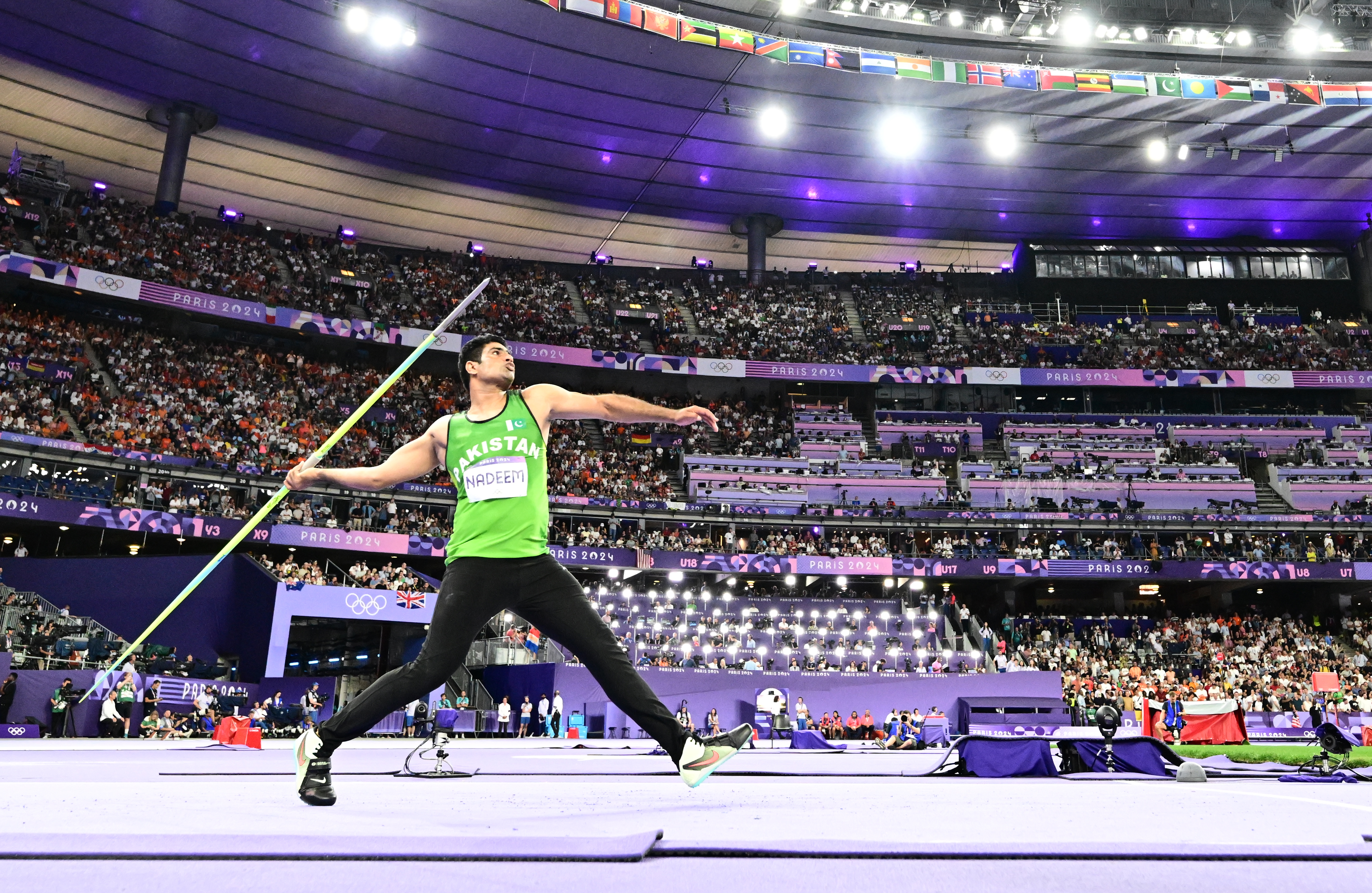epa11538303 Arshad Nadeem of Pakistan competes in the Men Javelin Throw final event of the Athletics competitions in the Paris 2024 Olympic Games, at the Stade de France stadium in Saint Denis, France, 08 August 2024. EPA-EFE/CHRISTIAN BRUNA