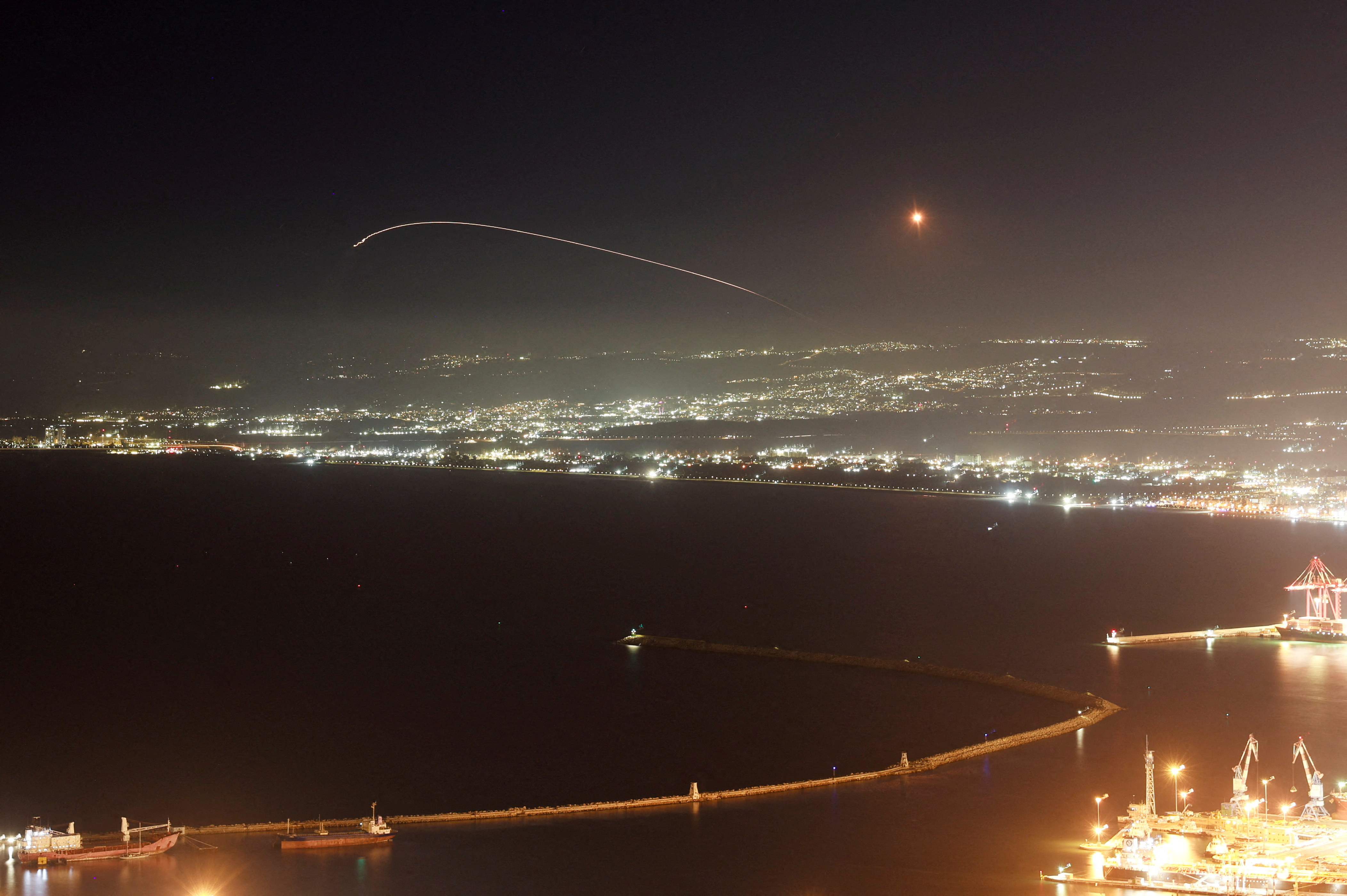 Israel's Iron Dome anti-missile system operates for interceptions as rockets are launched from Lebanon towards Israel, amid hostilities between Hezbollah and Israel, as seen from Haifa, Israel, October 3