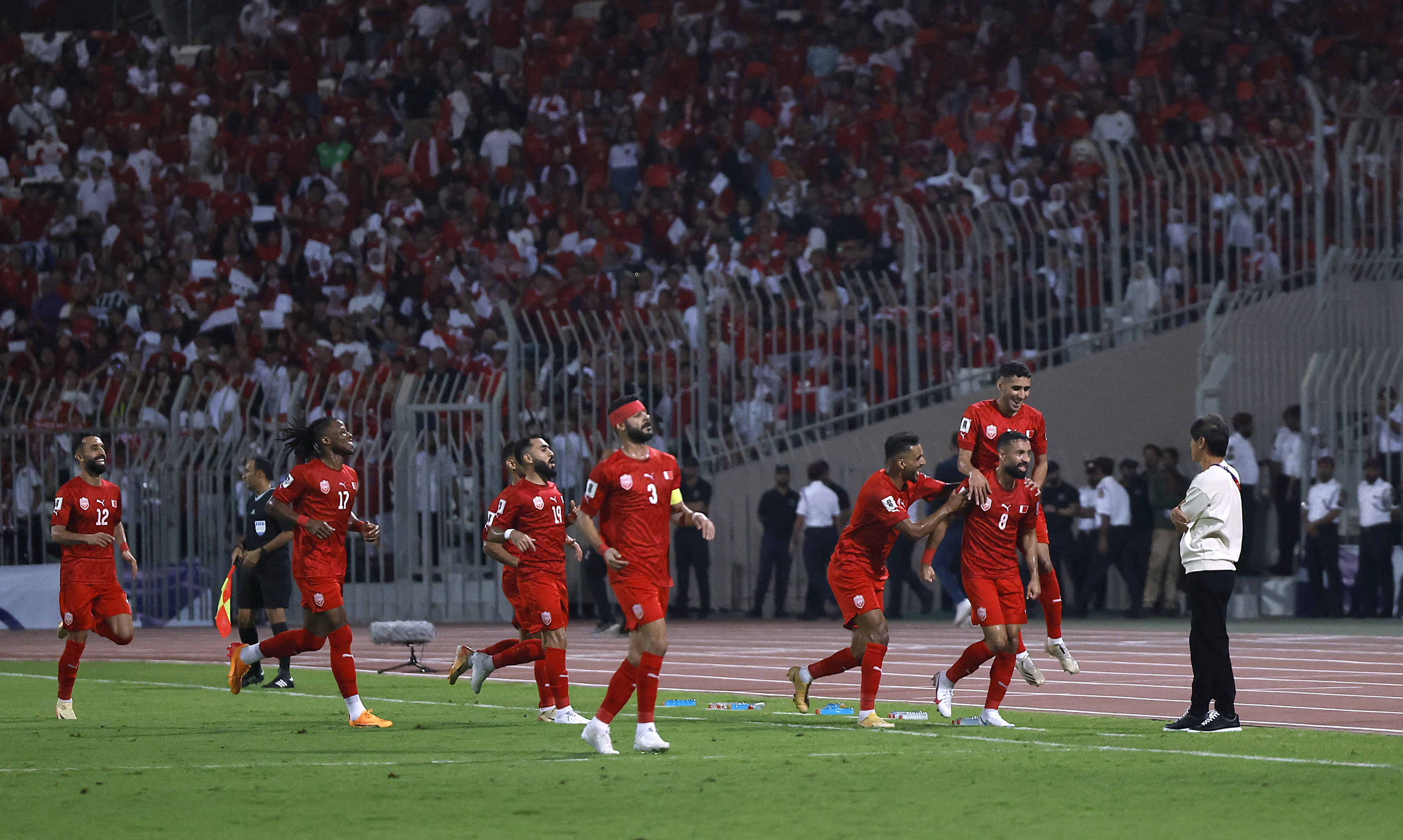 Bahrain's Mohamed Marhoon celebrates scoring their first goal