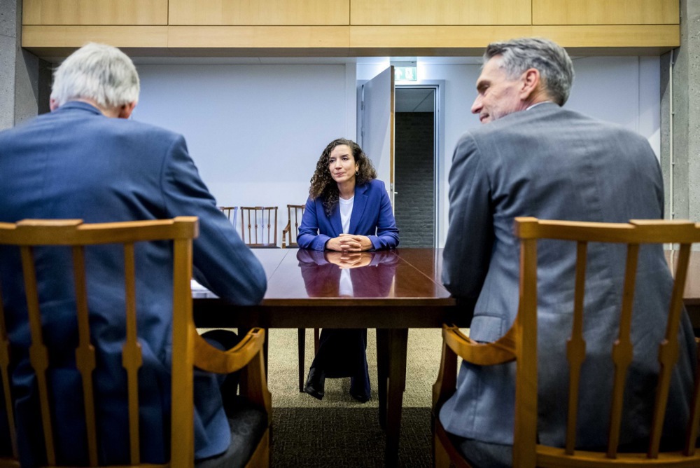 Nora Achahbar (centre) meets Prime Minister Dick Schoof (right) and top civil servant Richard van Zwol (left) in The Hague, June 19, 2024