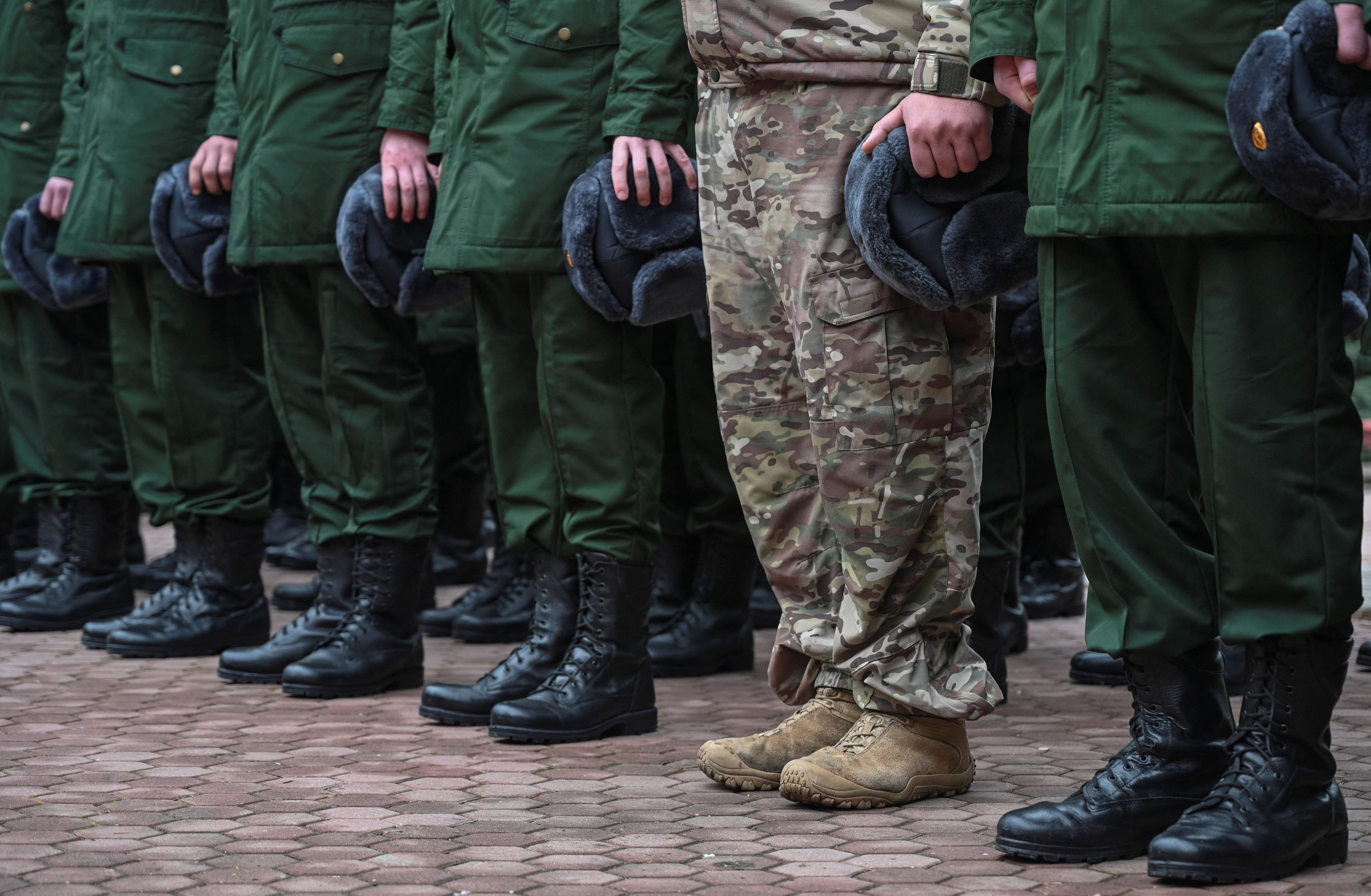 Russian conscripts called up for military service line up before their departure for garrisons in Bataysk in the Rostov region of Russia on October 20, 2024. The UK says its new sanctions will hamper Russia&#039;s military capabilities [Sergey Pivovarov/Reuters]