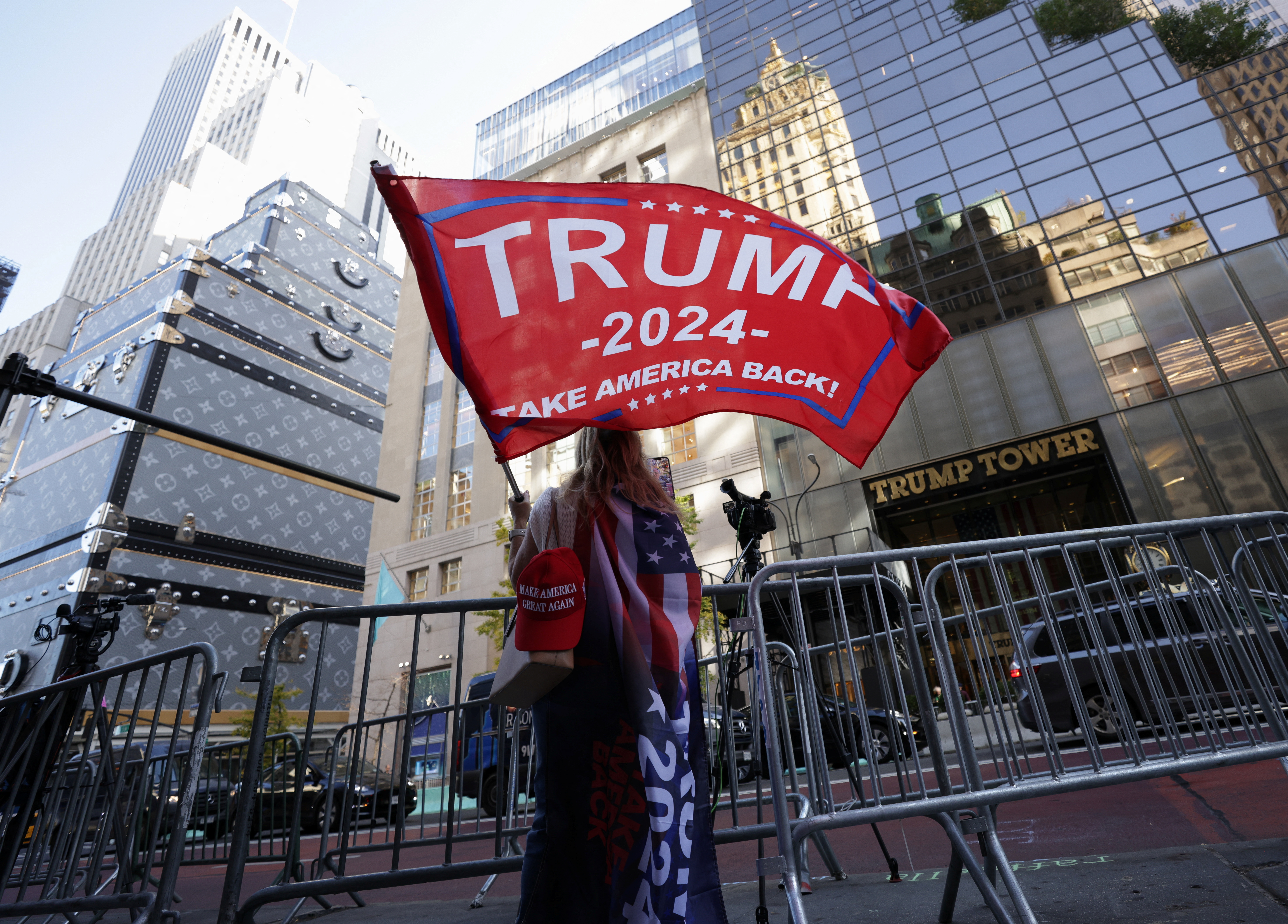 A person waves a Trump flag outside Trump Tower, after U.S. President-elect Donald Trump won the presidential election, in New York City, U.S., November 6