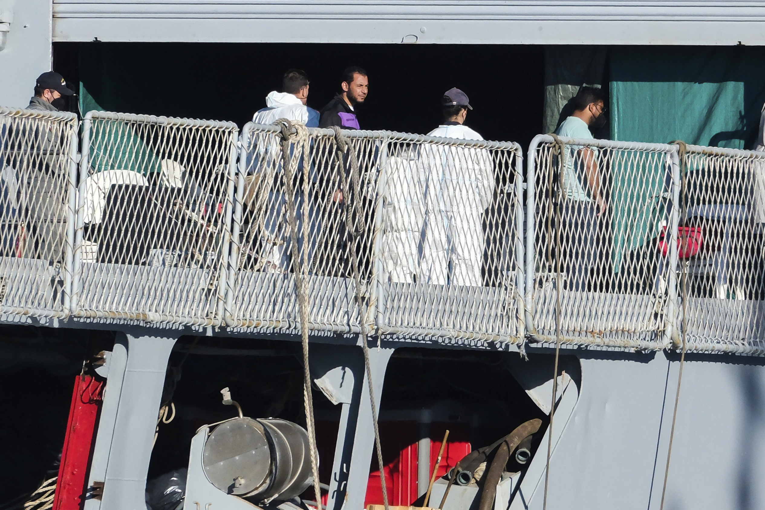 Migrants disembark from the Italian navy ship Libra at the port of Shengjin, northwestern Albania, Friday, Nov. 8, 2024, as a second group of eight migrants were intercepted in international waters. (AP Photo/Vlasov Sulaj)