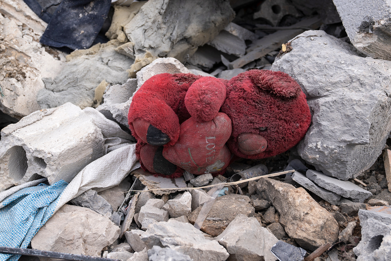 A red 'I love you' teddy bear lies in the ruins of a two-storey apartment block in Ain Yaaqoub, Akkar, Lebanon, in the aftermath of an Israeli air raid on Monday night [Raghed Waked/Al Jazeera]