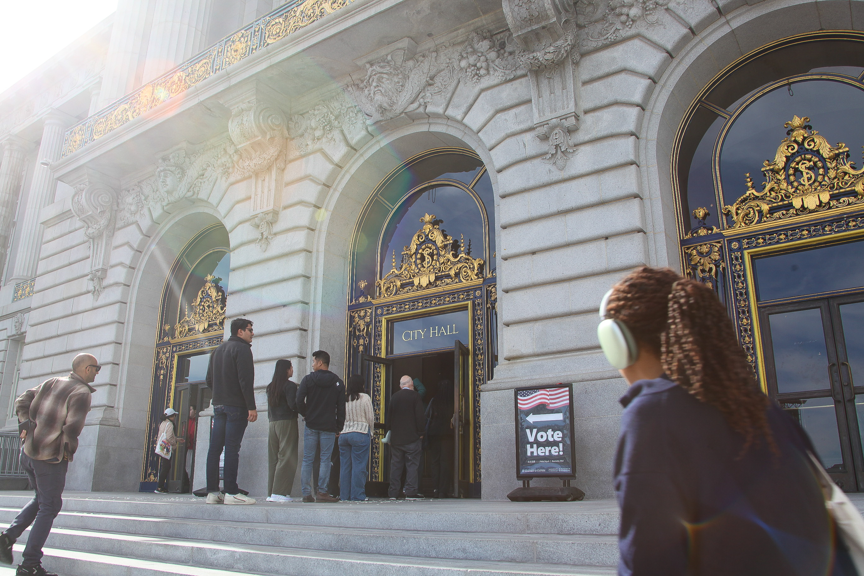 Voters line up outside City Hall in San Francisco to vote.