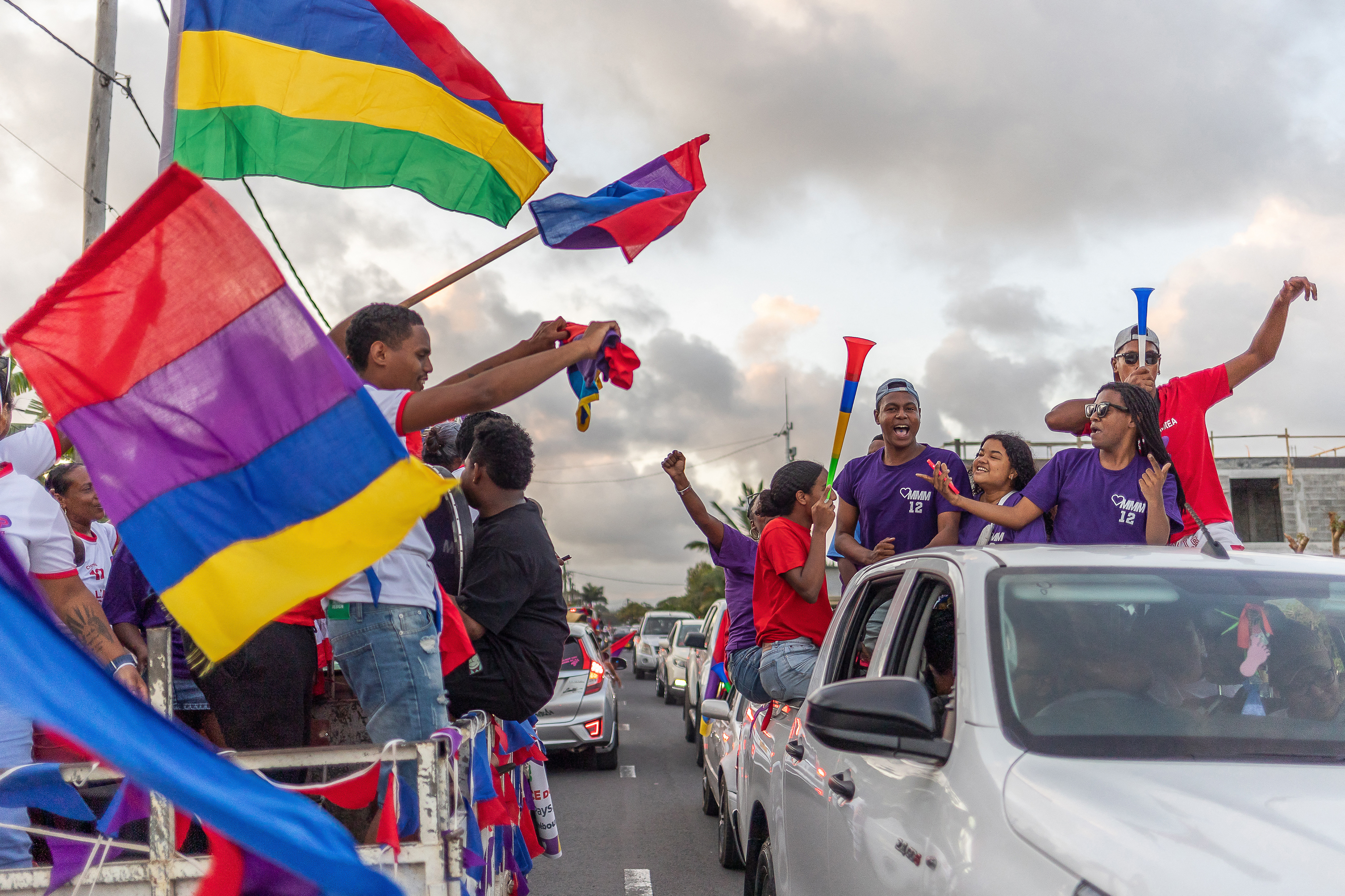 Supporters of the Alliance du Changement (Alliance for Change), led by opposition leader Navin Ramgoolam, celebrate following the announcement of initial results of Mauritius' legislative election [Laura Morosoli / AFP]