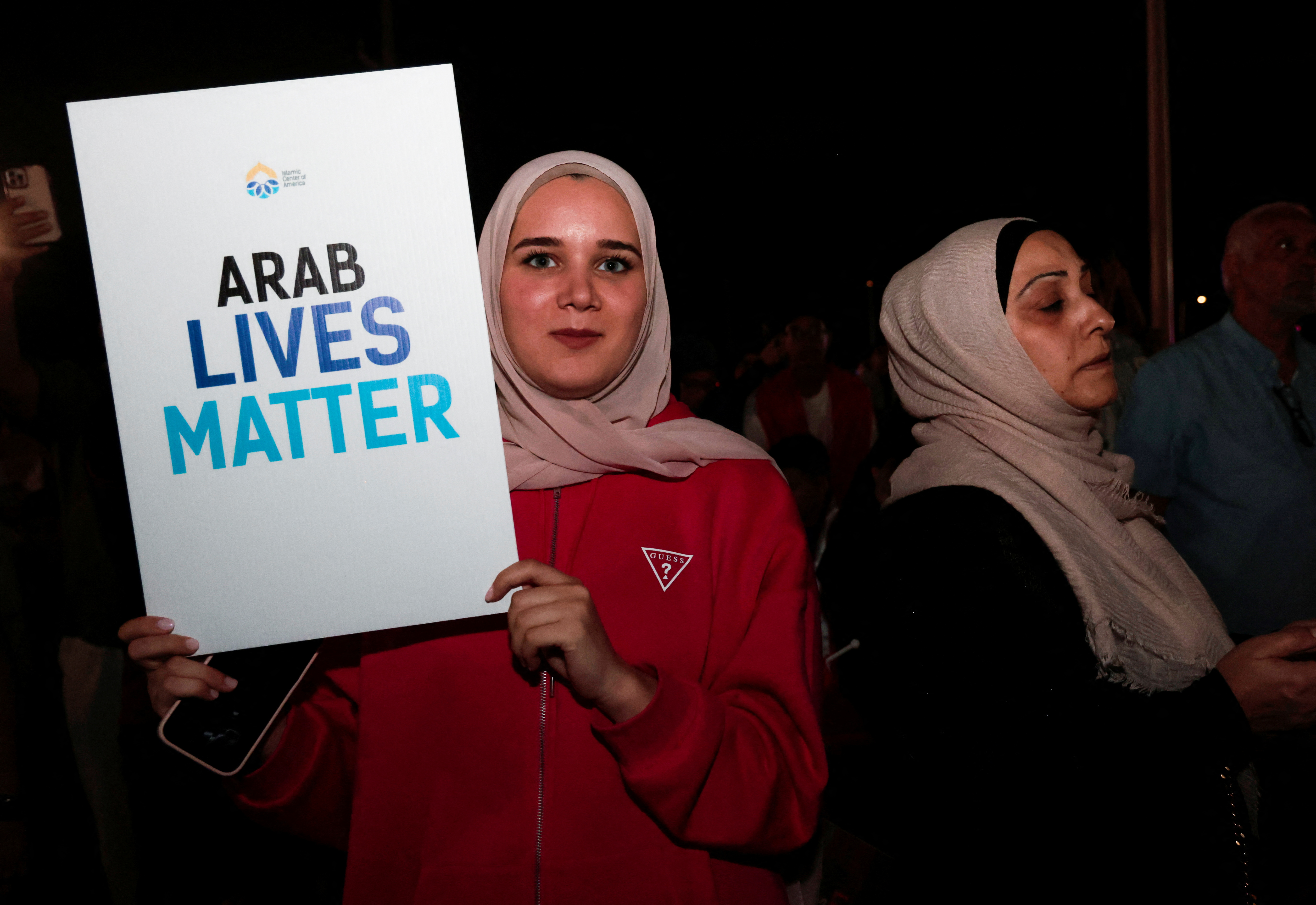 Arab Americans hold a vigil at the Islamic Center of America for the victims of a series of attacks in Lebanon, in Dearborn, Michigan, U.S., September 20, 2024. REUTERS/Rebecca Cook