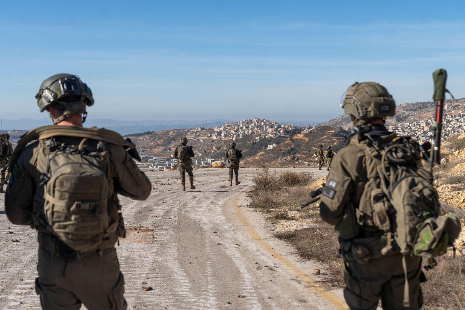 Israeli soldiers stand in the occupied Syrian Golan Heights
