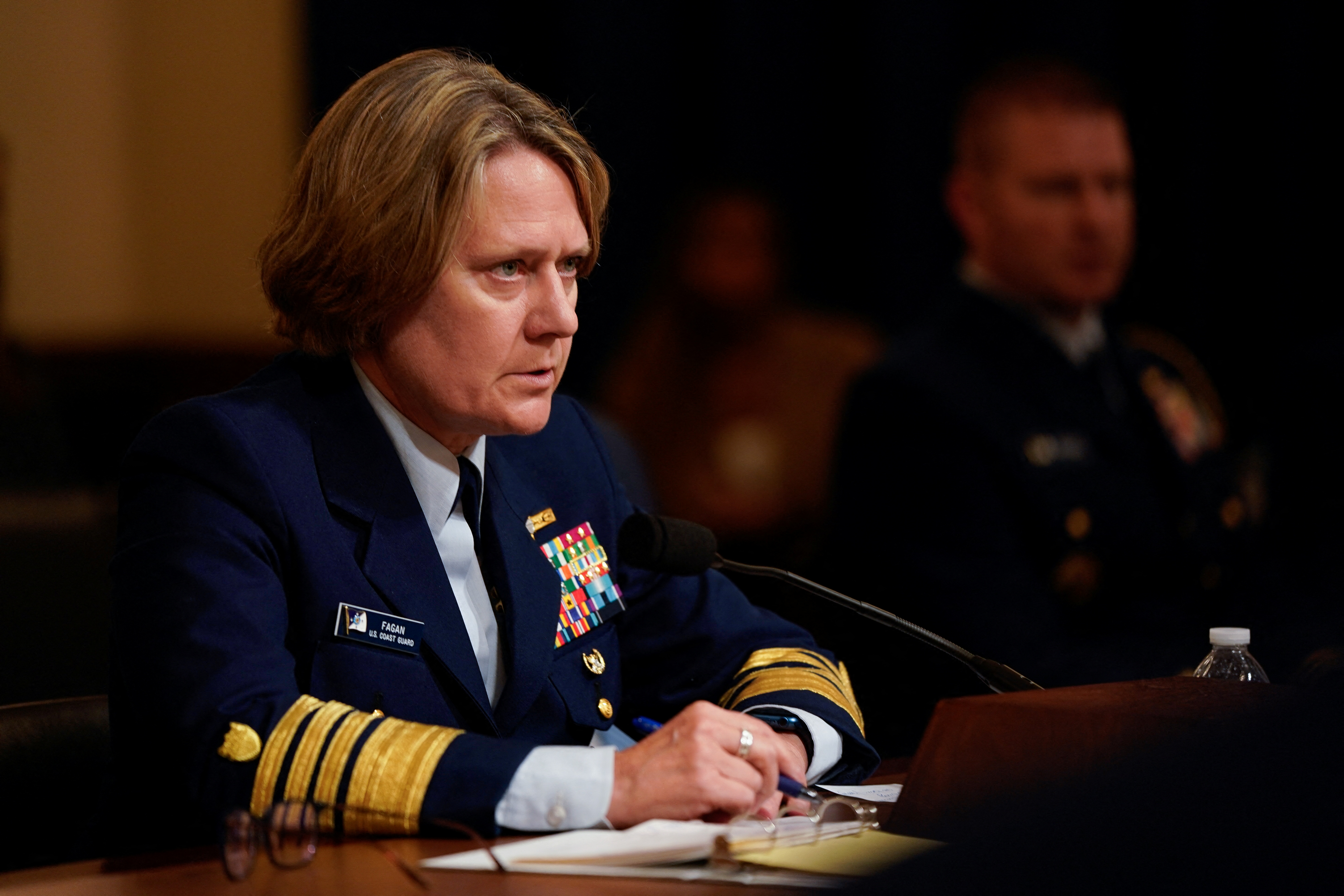 Linda Fagan, in dress uniform, testifying before Congress.