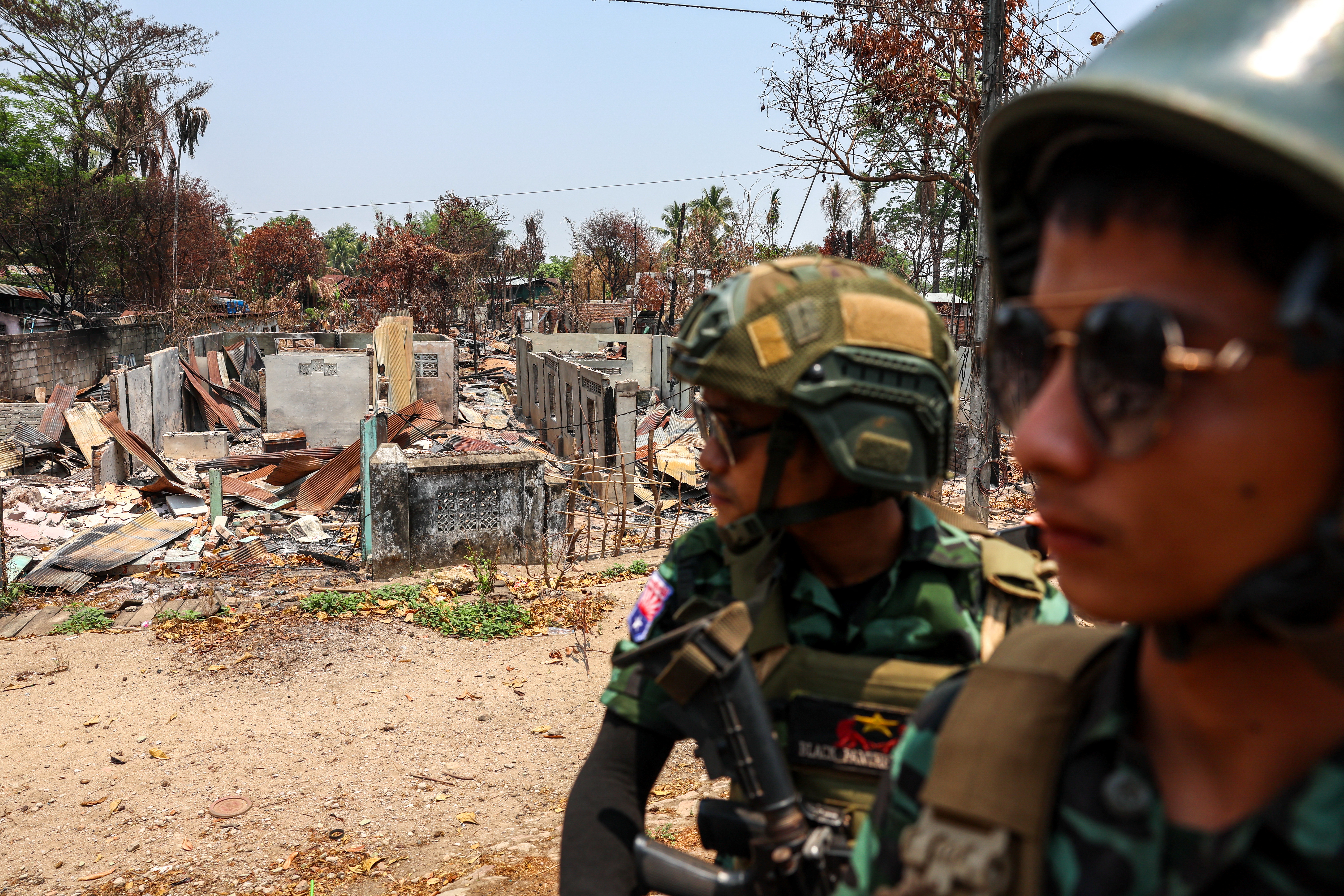 Soldiers from the Karen National Liberation Army (KNLA) on patrol in Myawaddy, the Thailand-Myanmar border town under the control of a coalition of rebel forces led by the Karen National Union (KNU), in Myanmar, in April 2024 [File: Athit Perawongmetha/Reuters]