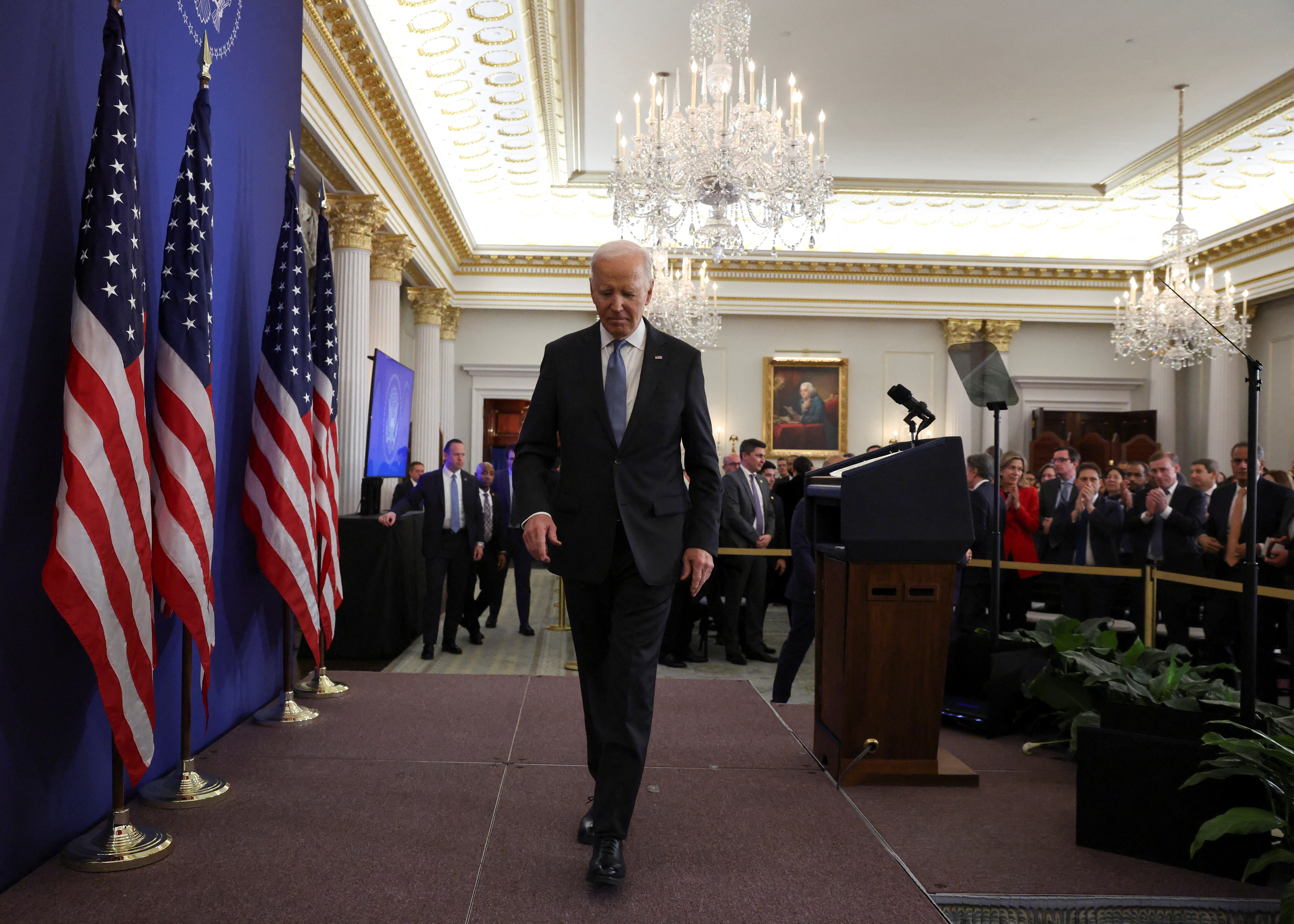 US President Joe Biden leaves the stage after his speech at the State Department in Washington, on January 13, 2025. [Evelyn Hockstein/Reuters]