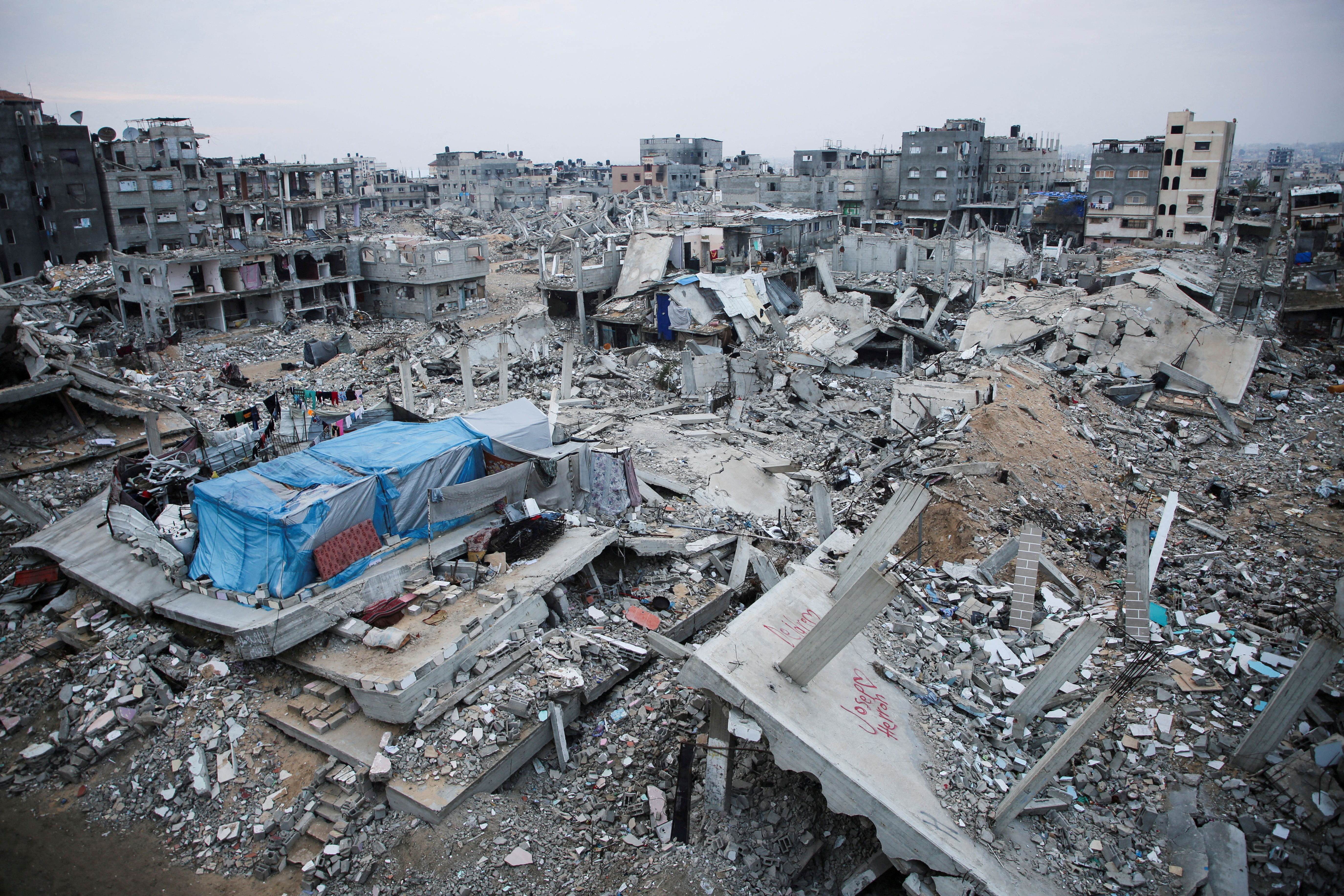Houses destroyed in Israeli attacks lie in ruin.