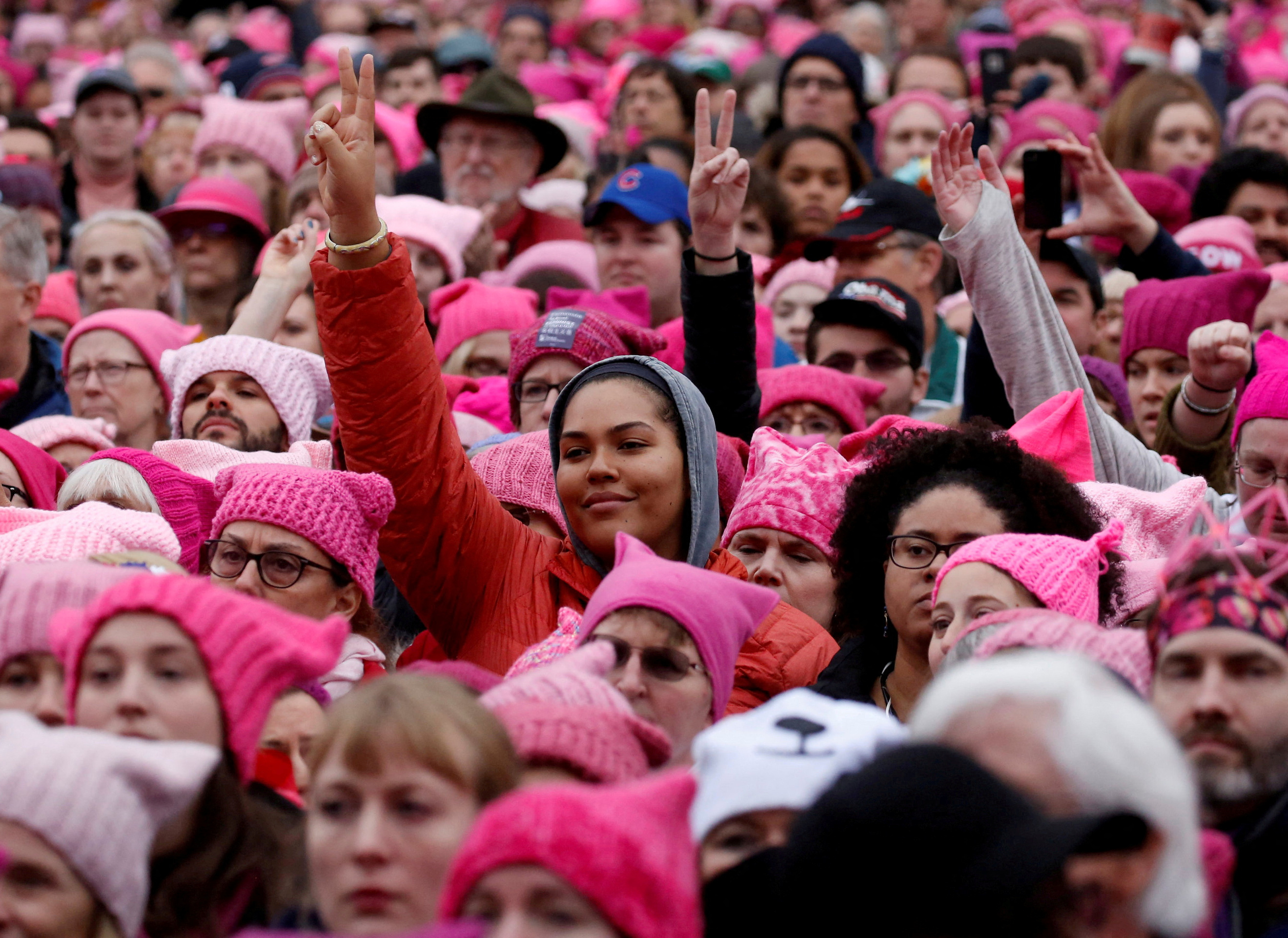 Women in pink "pussy hats" gather en masse in Washington, DC.