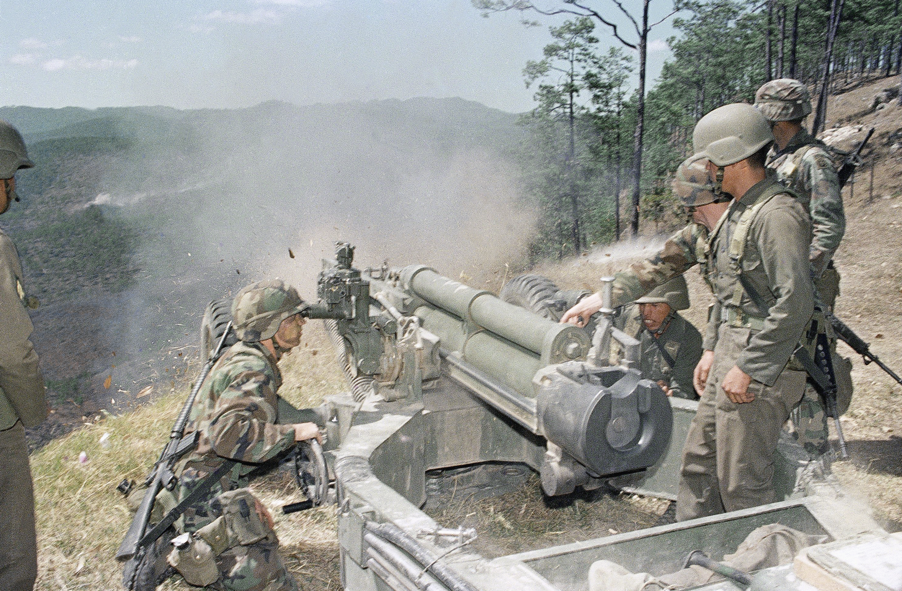 US and Honduras troops work together during training exercises at Zambrano Artillery Range in Honduras [File: Tannen Maury/AP Photo]