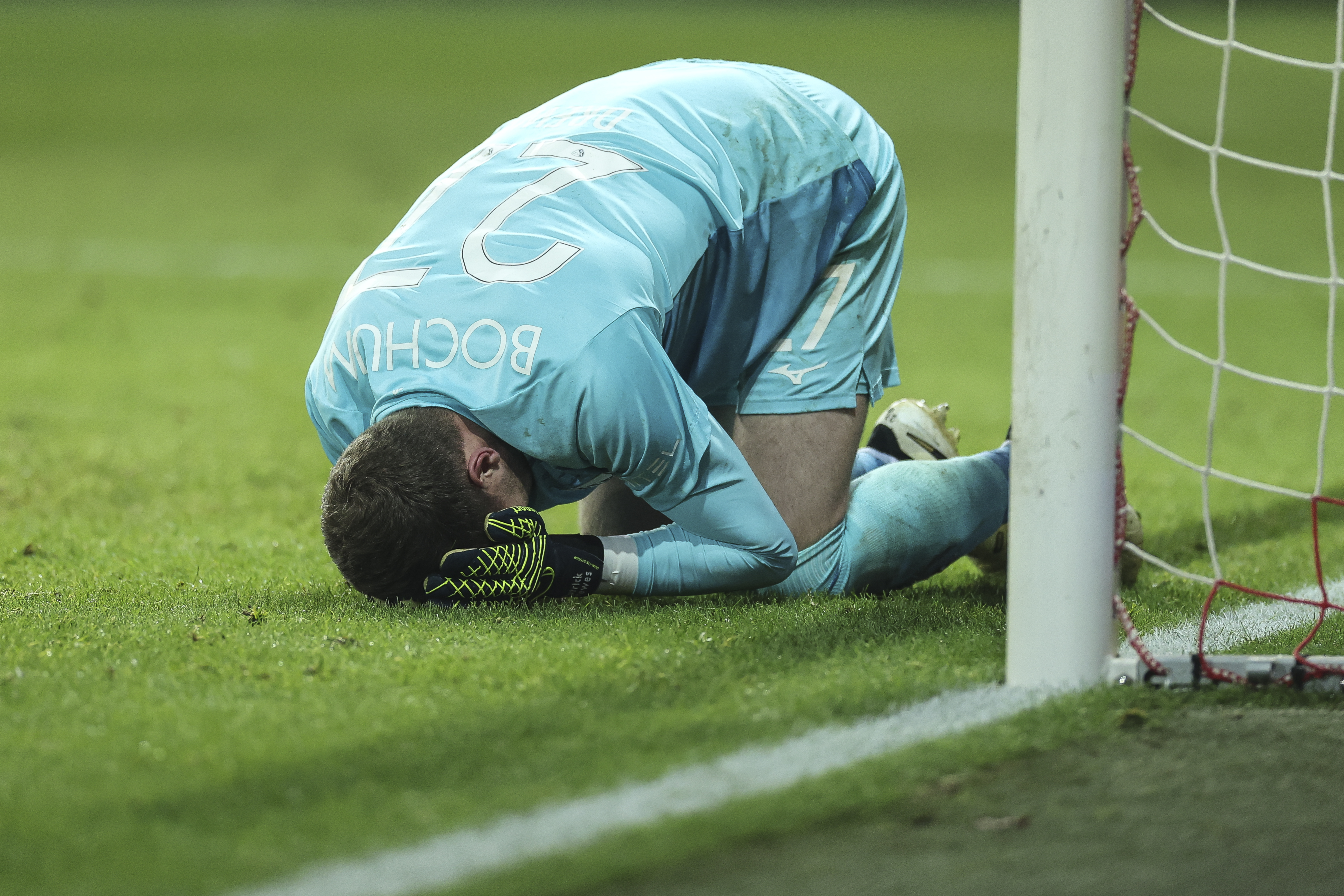 BERLIN, GERMANY - DECEMBER 14: Patrick Drewes of VfL Bochum reacts after he was hit by lighter from a fan during the Bundesliga match between 1. FC Union Berlin and VfL Bochum 1848 at Stadion An der Alten Foersterei on December 14, 2024 in Berlin, Germany. (Photo by Maja Hitij/Getty Images)