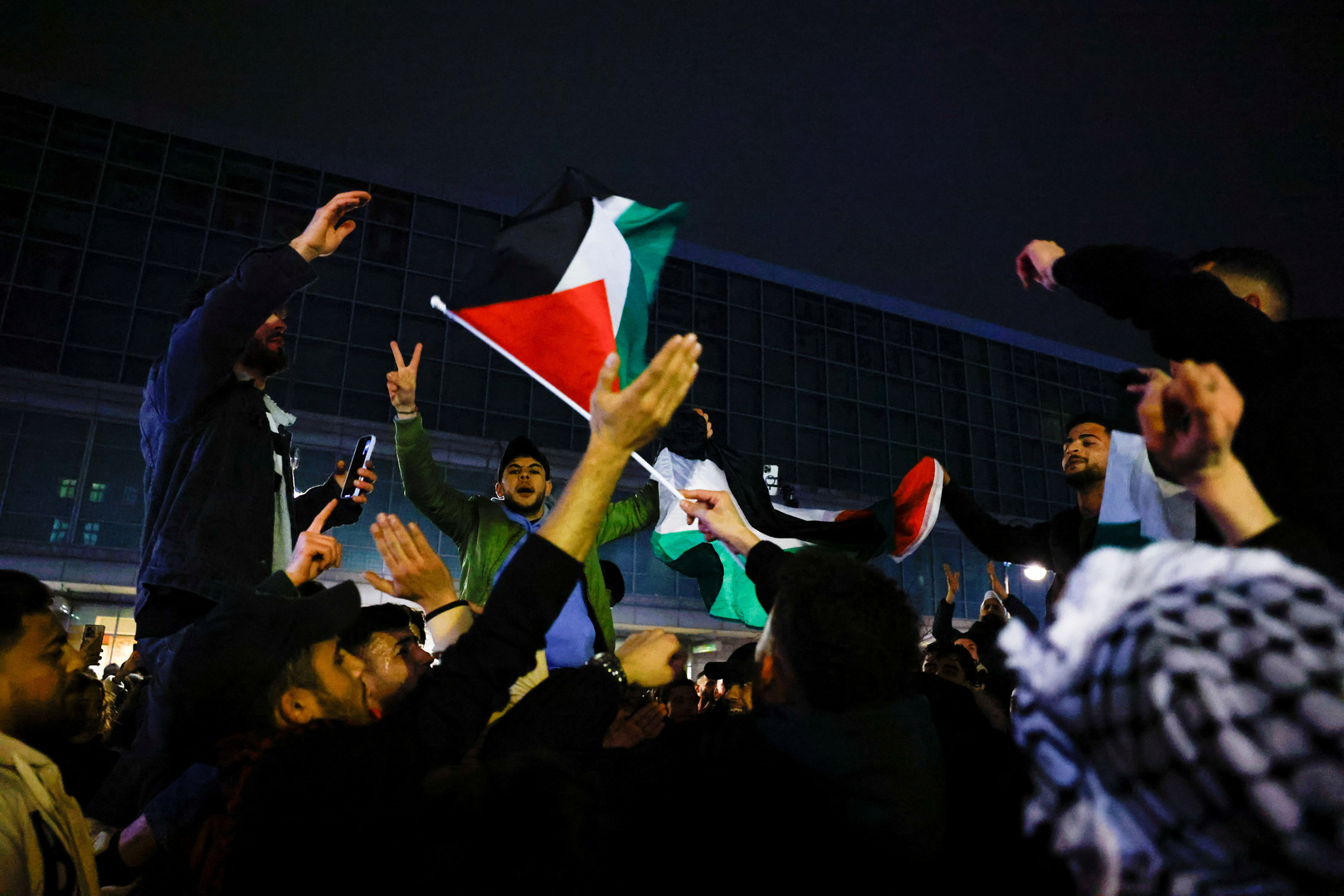 Palestinians celebrate the ceasefire announcement.