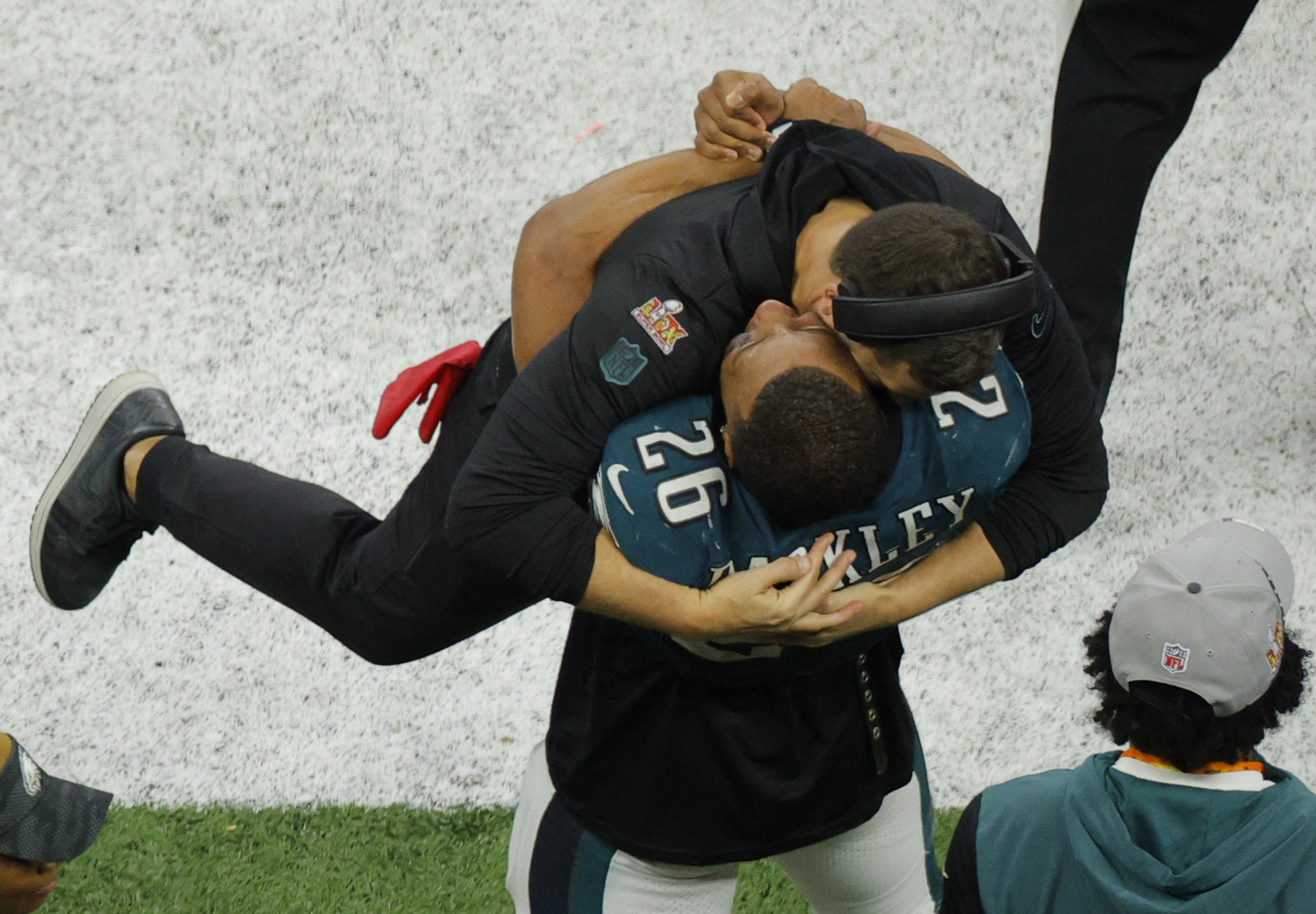 Football - NFL - Super Bowl LIX - Philadelphia Eagles v Kansas City Chiefs - Caesars Superdome, New Orleans, Louisiana, United States - February 9, 2025 Philadelphia Eagles' Saquon Barkley celebrates with head coach Nick Sirianni during the fourth quarter REUTERS/Brian Snyder