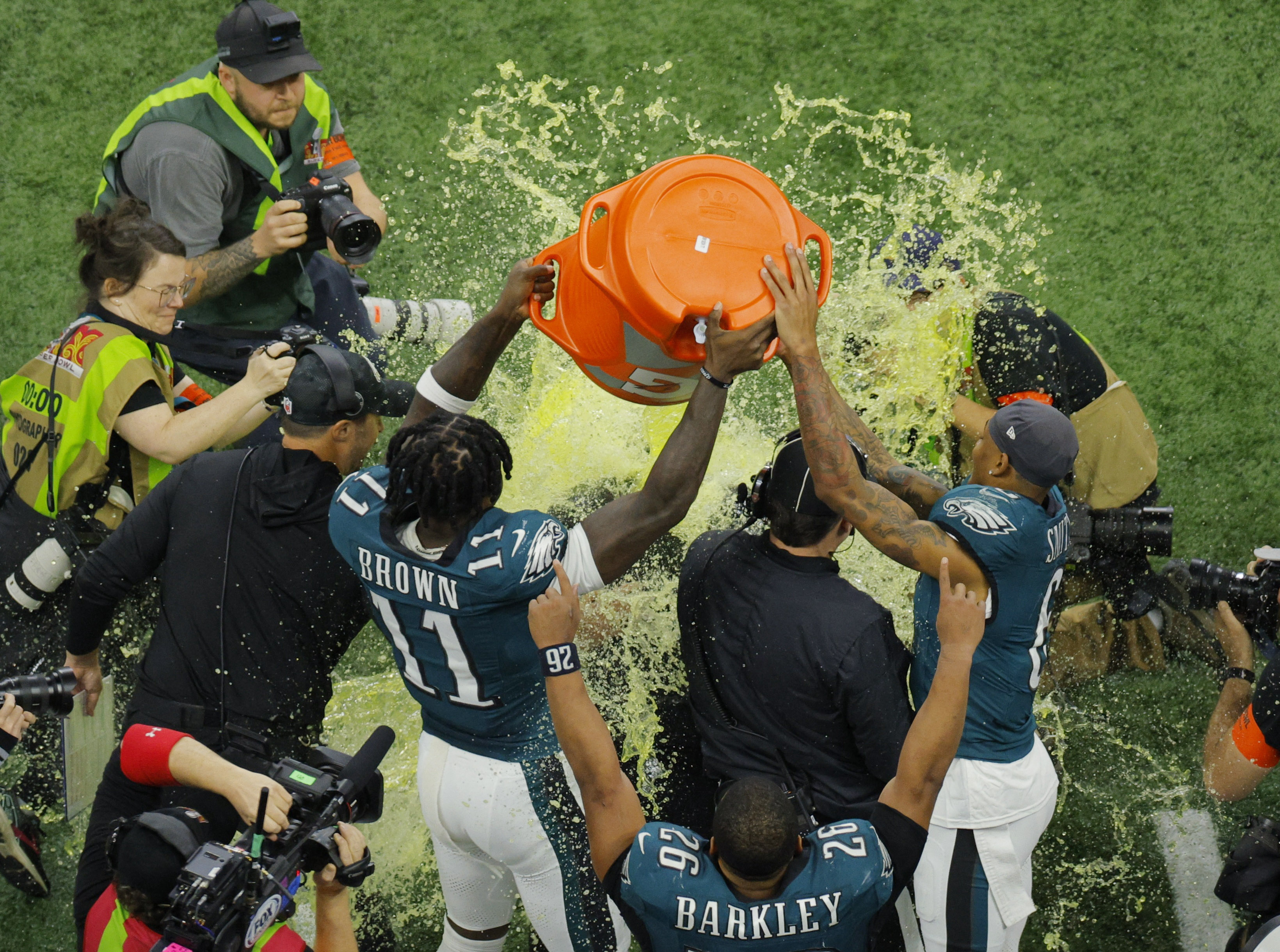 Football - NFL - Super Bowl LIX - Philadelphia Eagles v Kansas City Chiefs - Caesars Superdome, New Orleans, Louisiana, United States - February 9, 2025 Philadelphia Eagles' A.J. Brown and DeVonta Smith pour Gatorade over head coach Nick Sirianni during the fourth quarter REUTERS/Brian Snyder