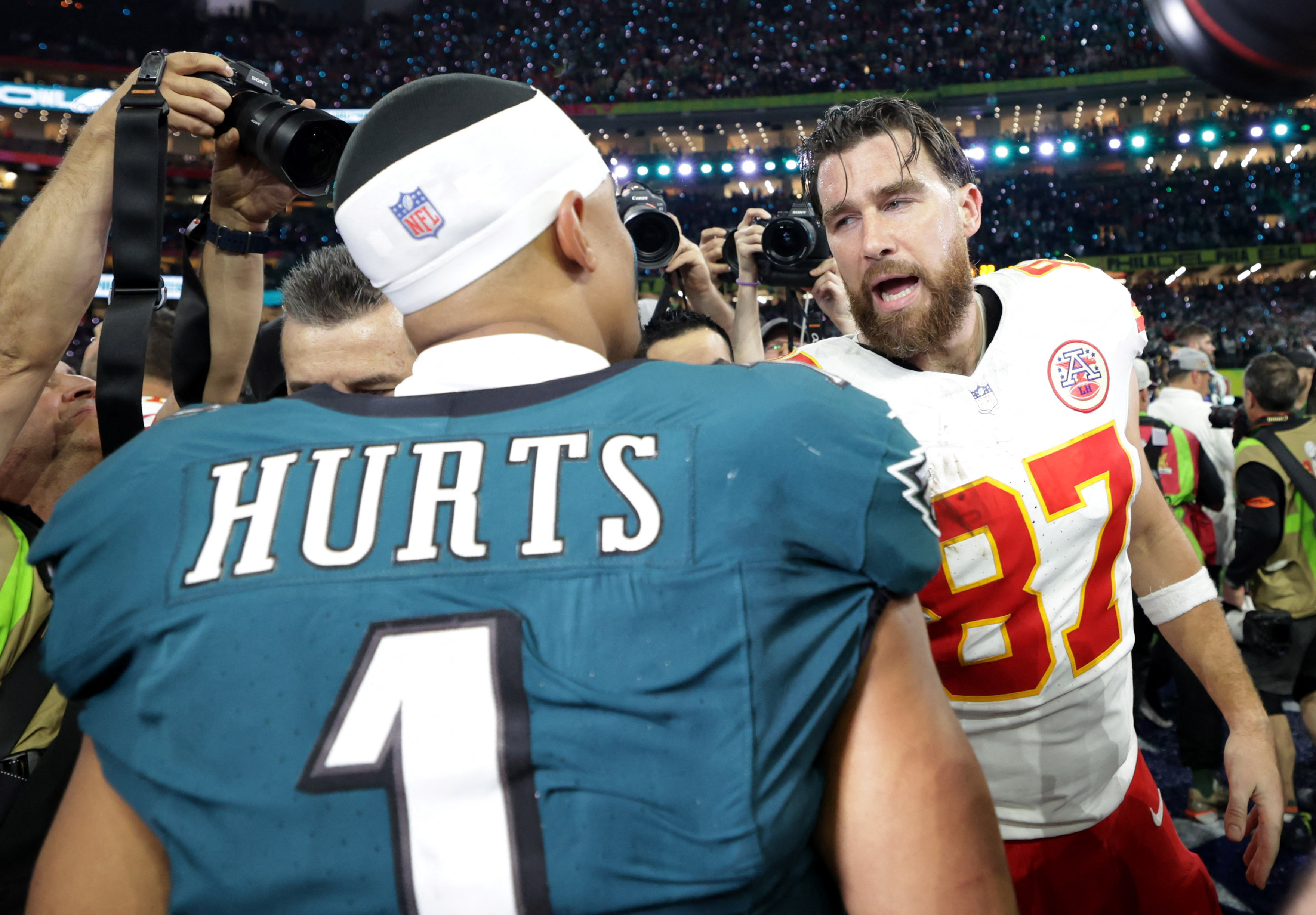 Football - NFL - Super Bowl LIX - Philadelphia Eagles v Kansas City Chiefs - Caesars Superdome, New Orleans, Louisiana, United States - February 9, 2025 Philadelphia Eagles' Jalen Hurts shakes hands with Kansas City Chiefs' Travis Kelce after the game REUTERS/Mike Segar