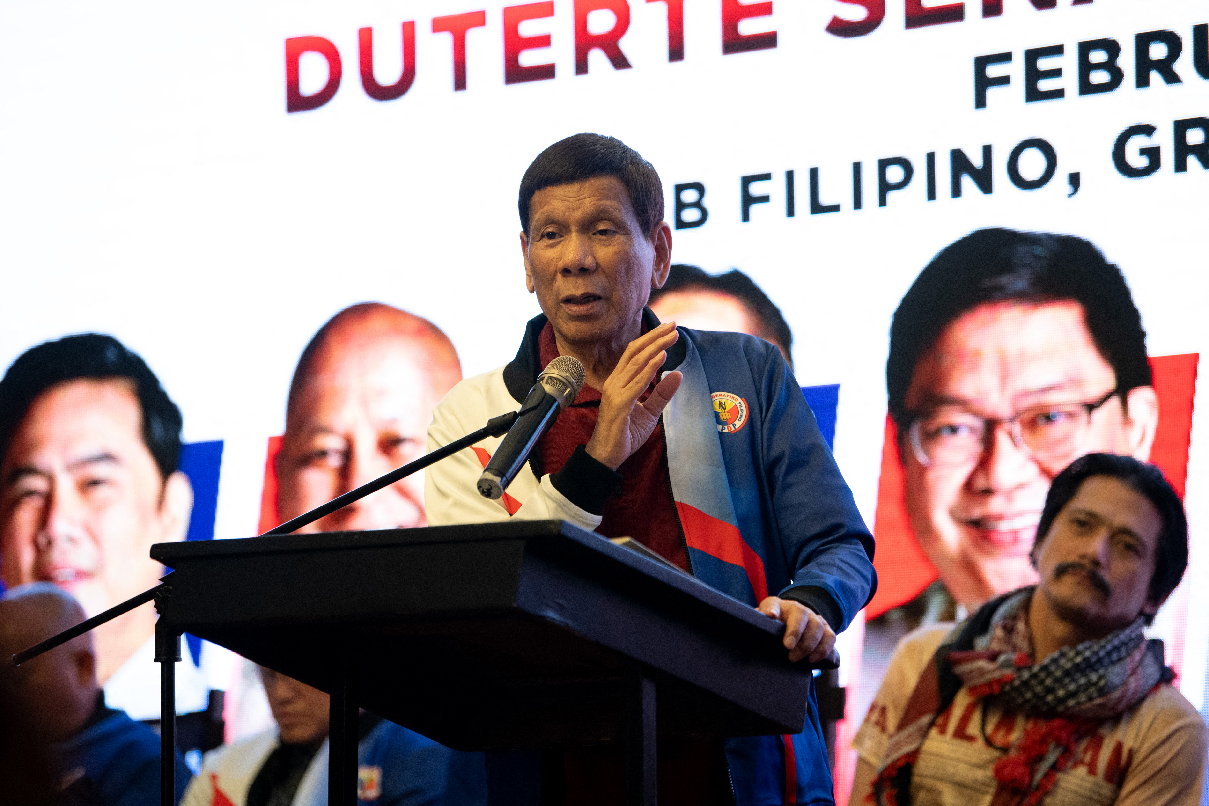 Philippine's former president Rodrigo Duterte (C) addresses a proclamation rally for his senatorial candidates of the Partido Demokratiko Pilipino party ahead of the midterm elections, at a social club in Manila on February 13, 2025. (Photo by Ted ALJIBE / AFP)
