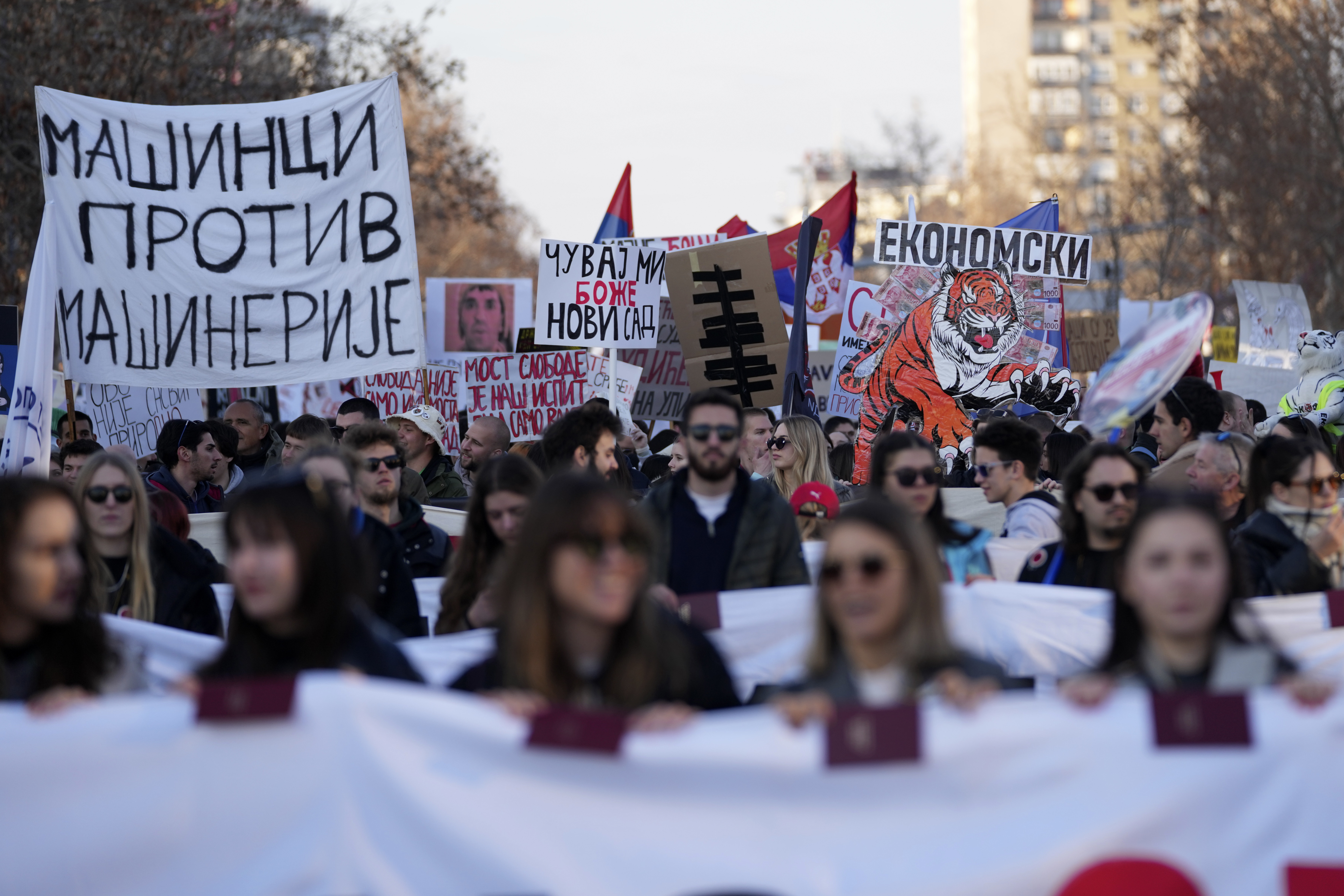 People march during a protest over the collapse of a concrete canopy that killed 15 people more than two months ago, in Novi Sad, Serbia