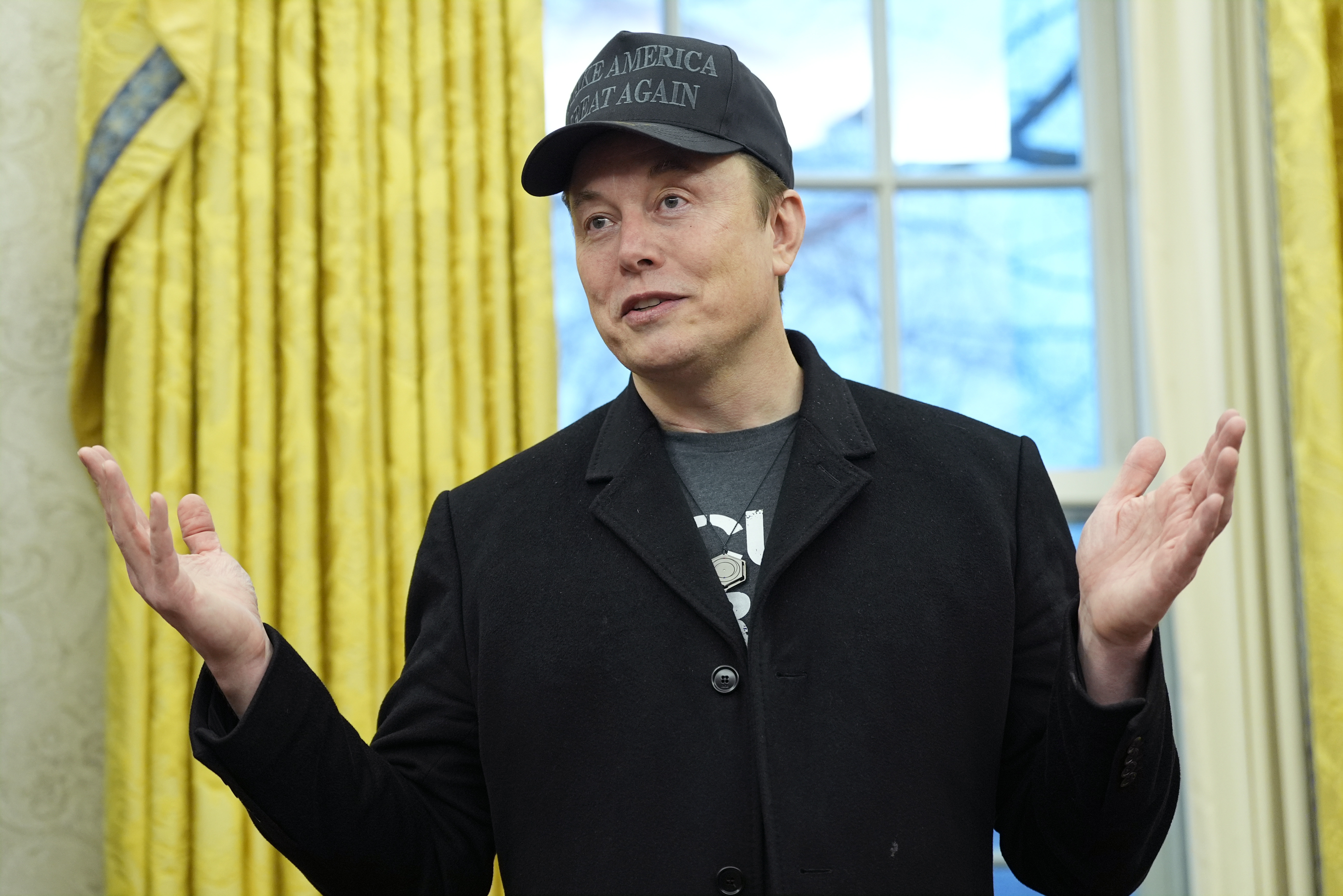Elon Musk speaks during an event with President Donald Trump in the Oval Office [File: Alex Brandon/AP]