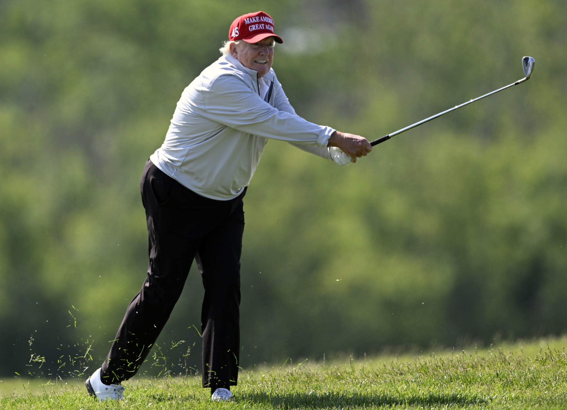 Donald Trump playing golf.