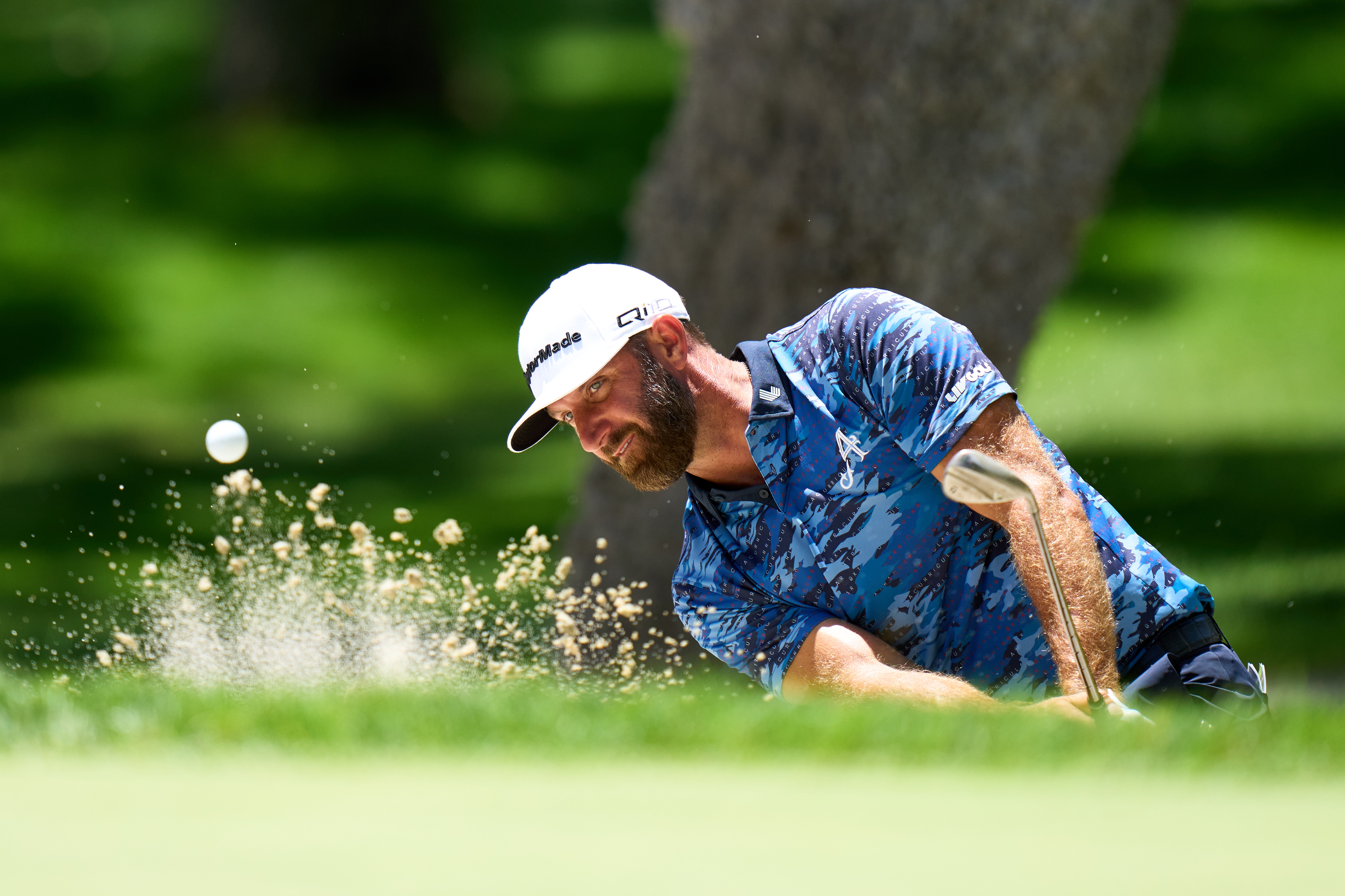 Dustin Johnson plays a golf shot.