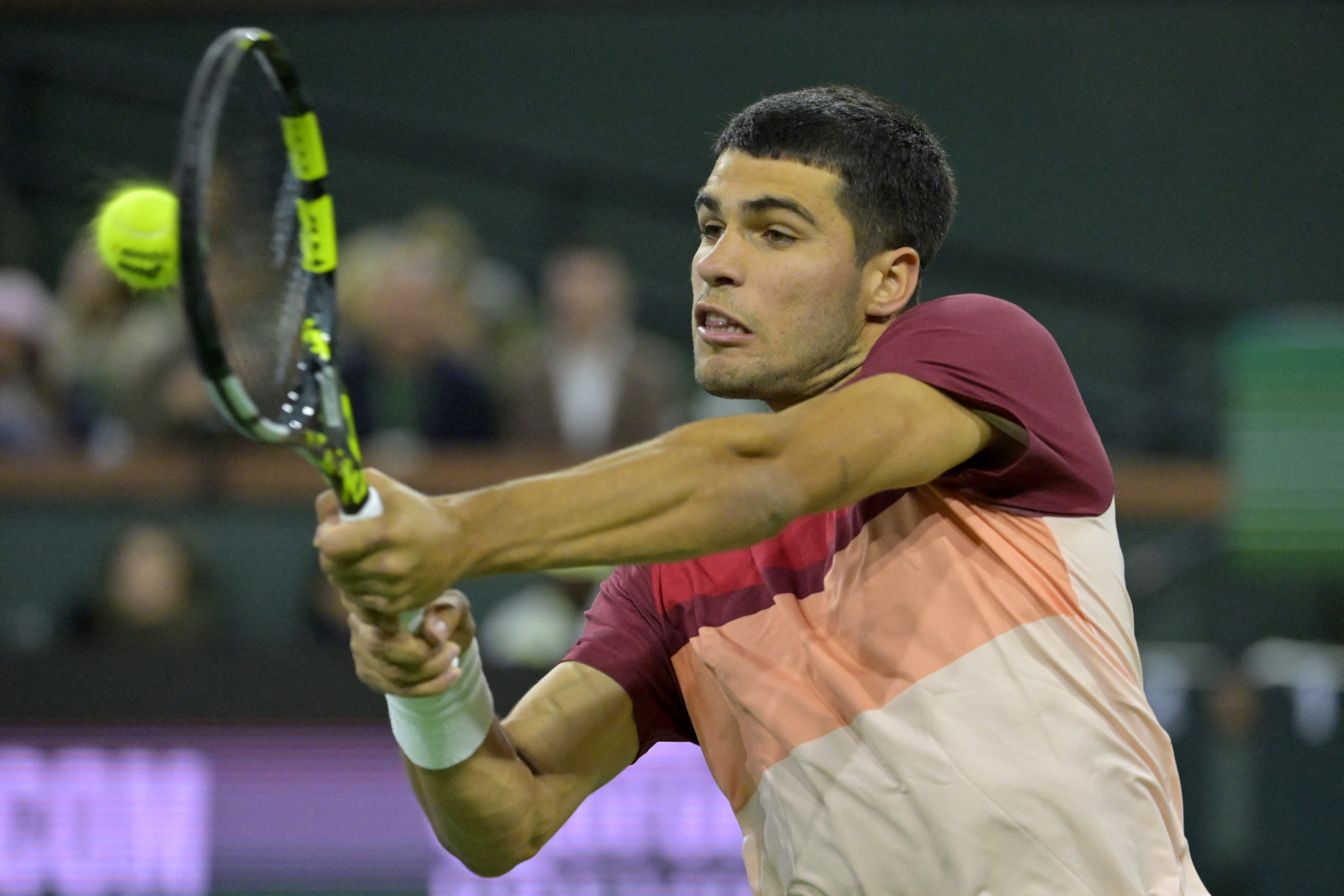 Carlos Alcaraz hits a shot.
