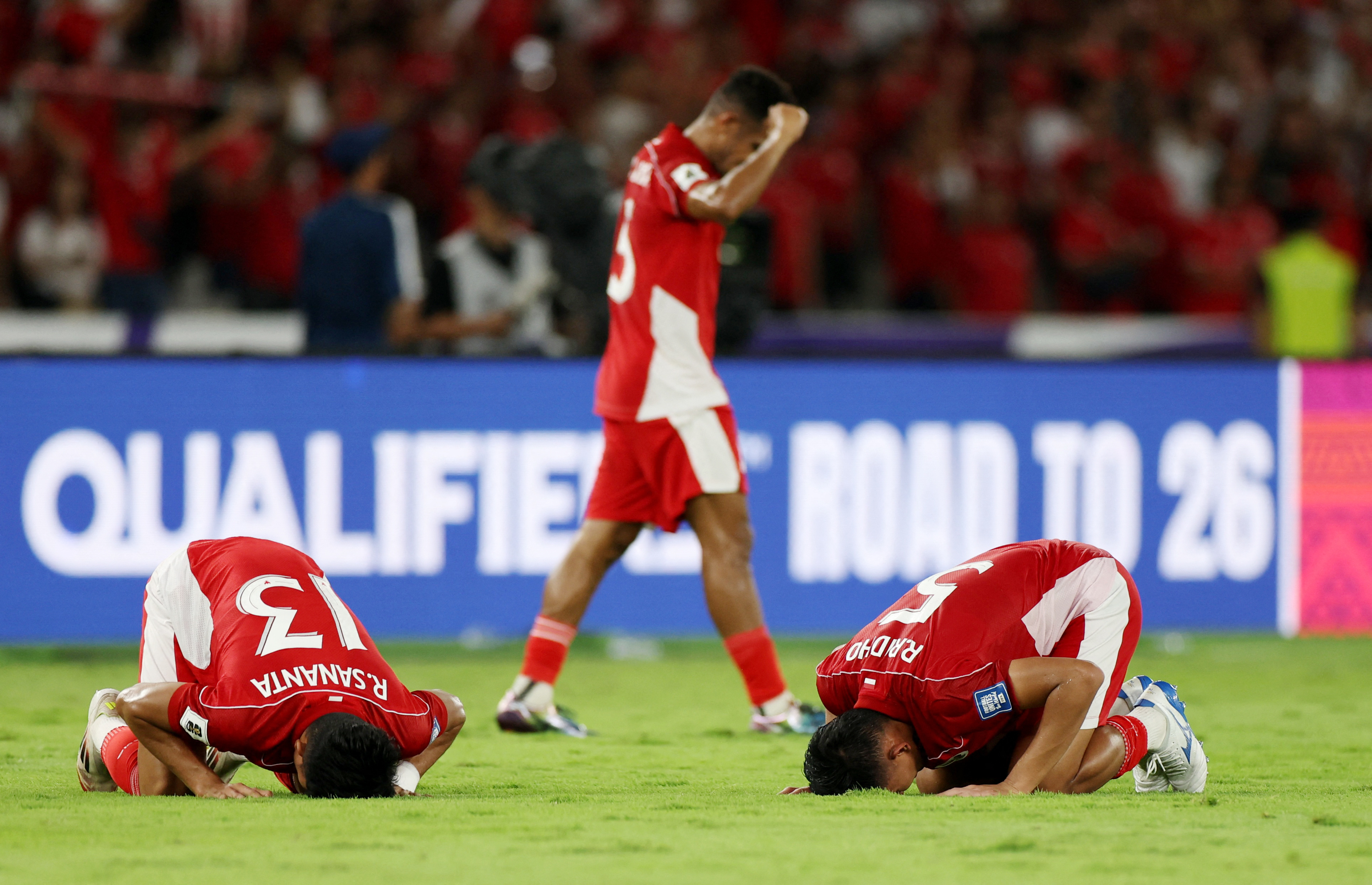 Soccer Football - World Cup - AFC Qualifiers - Third Round - Group C - Indonesia v Bahrain - Gelora Bung Karno Complex, Jakarta, Indonesia - March 25, 2025 Indonesia's Rizky Ridho and Ramadhan Sananta celebrate after the match REUTERS/Ajeng Dinar Ulfiana