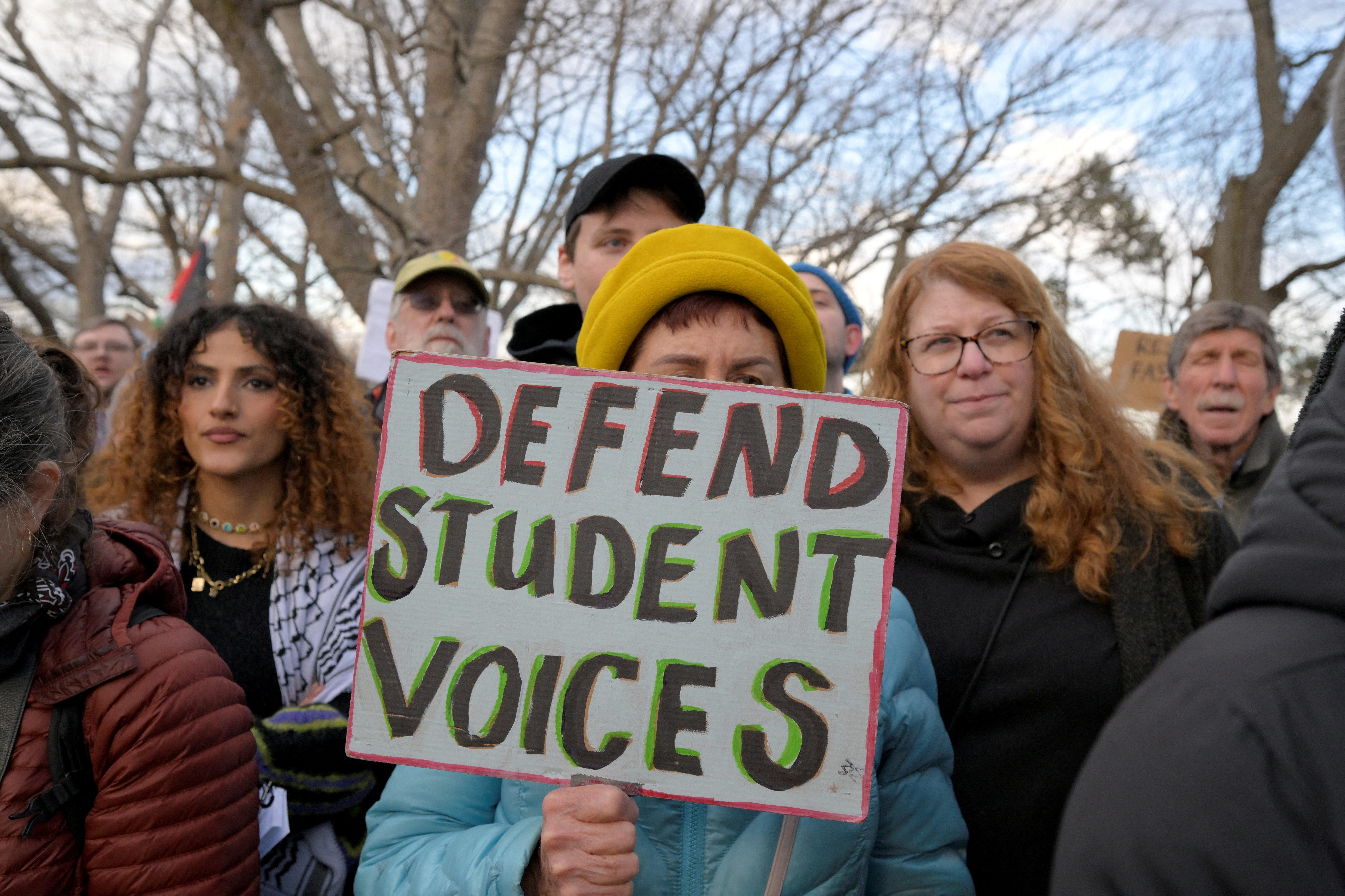 Demonstrators take part in the Stand with Rumeysa Ozturk,Tufts PHD Student emergency rally, at Powder House Square Park, after Ozturk was taken into custody by federal agents, in Somerville, Massachusetts, U.S. March 26, 2025.