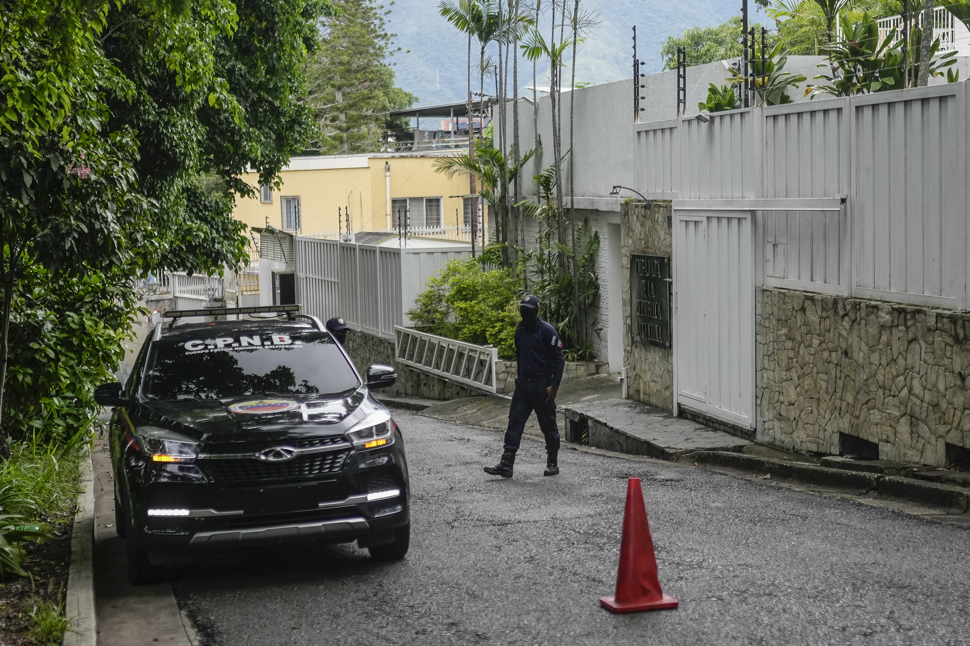 A police car is parked outside the Argentine embassy in Caracas