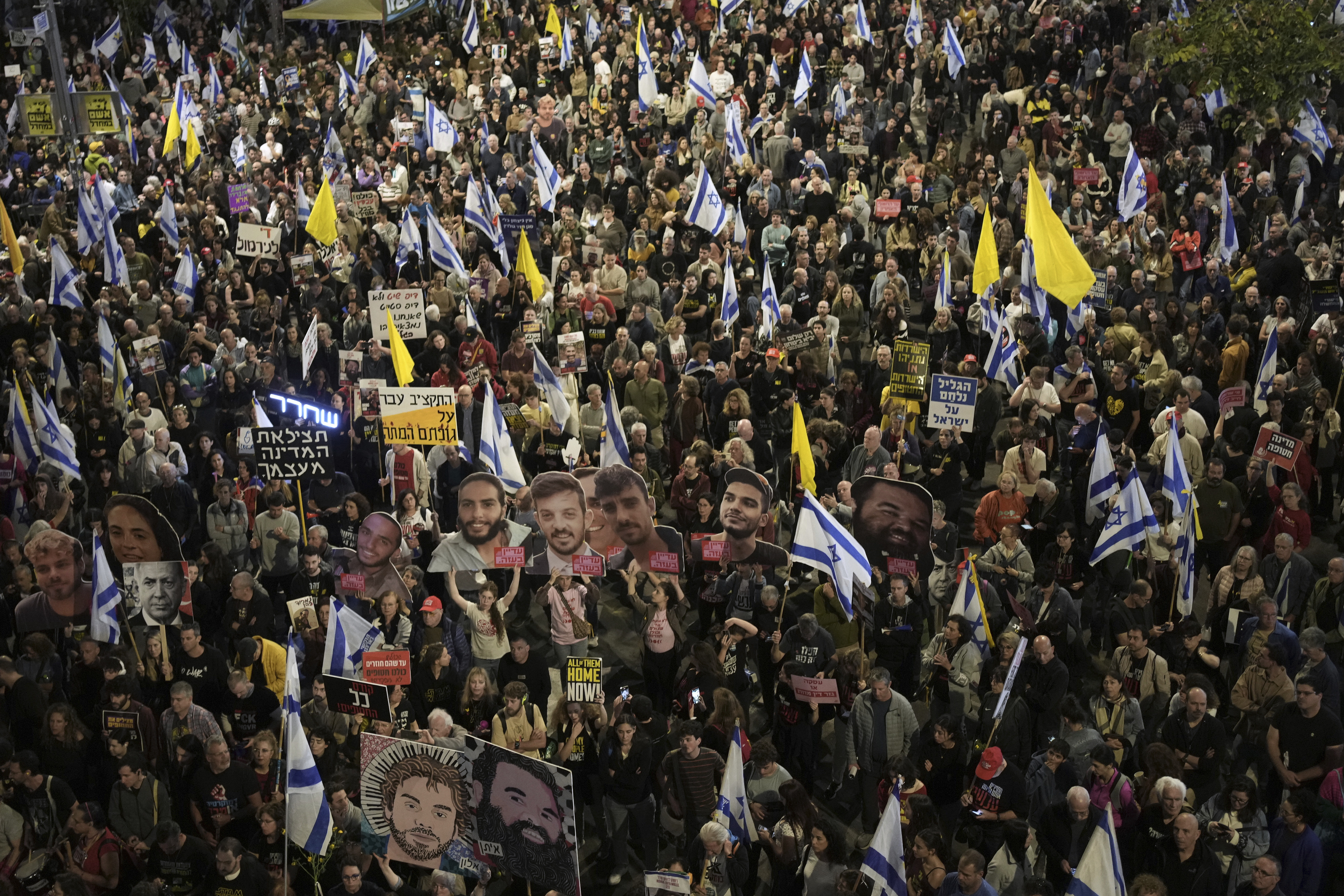 People take part in a protest demanding the immediate release of hostages held by Hamas in the Gaza Strip, in Tel Aviv, Israel, Saturday, March 29, 2025. (AP Photo/Maya Alleruzzo)