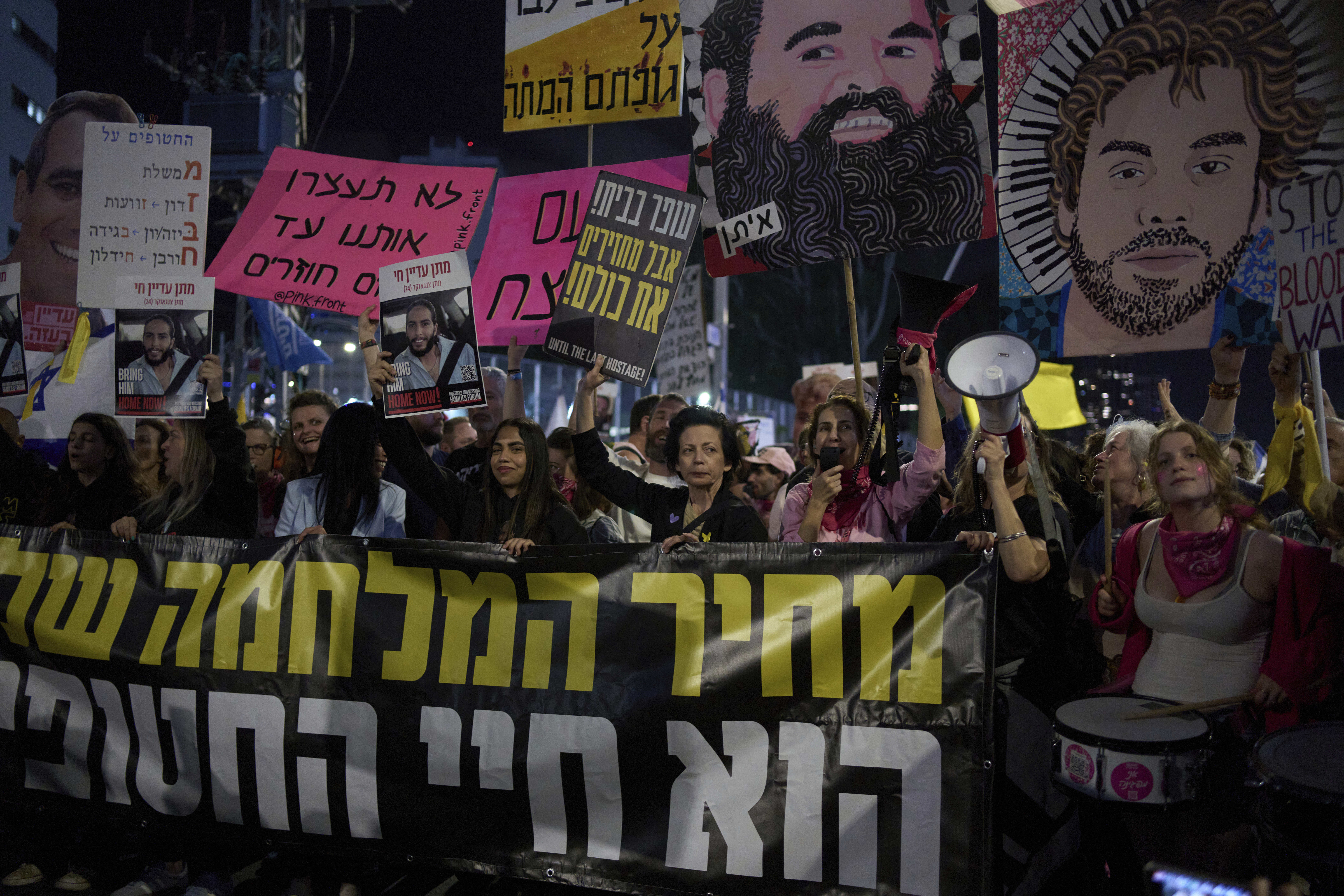 People take part in a protest demanding the immediate release of hostages held by Hamas in the Gaza Strip, in Tel Aviv, Israel, Saturday, March 29, 2025. (AP Photo/Maya Alleruzzo)