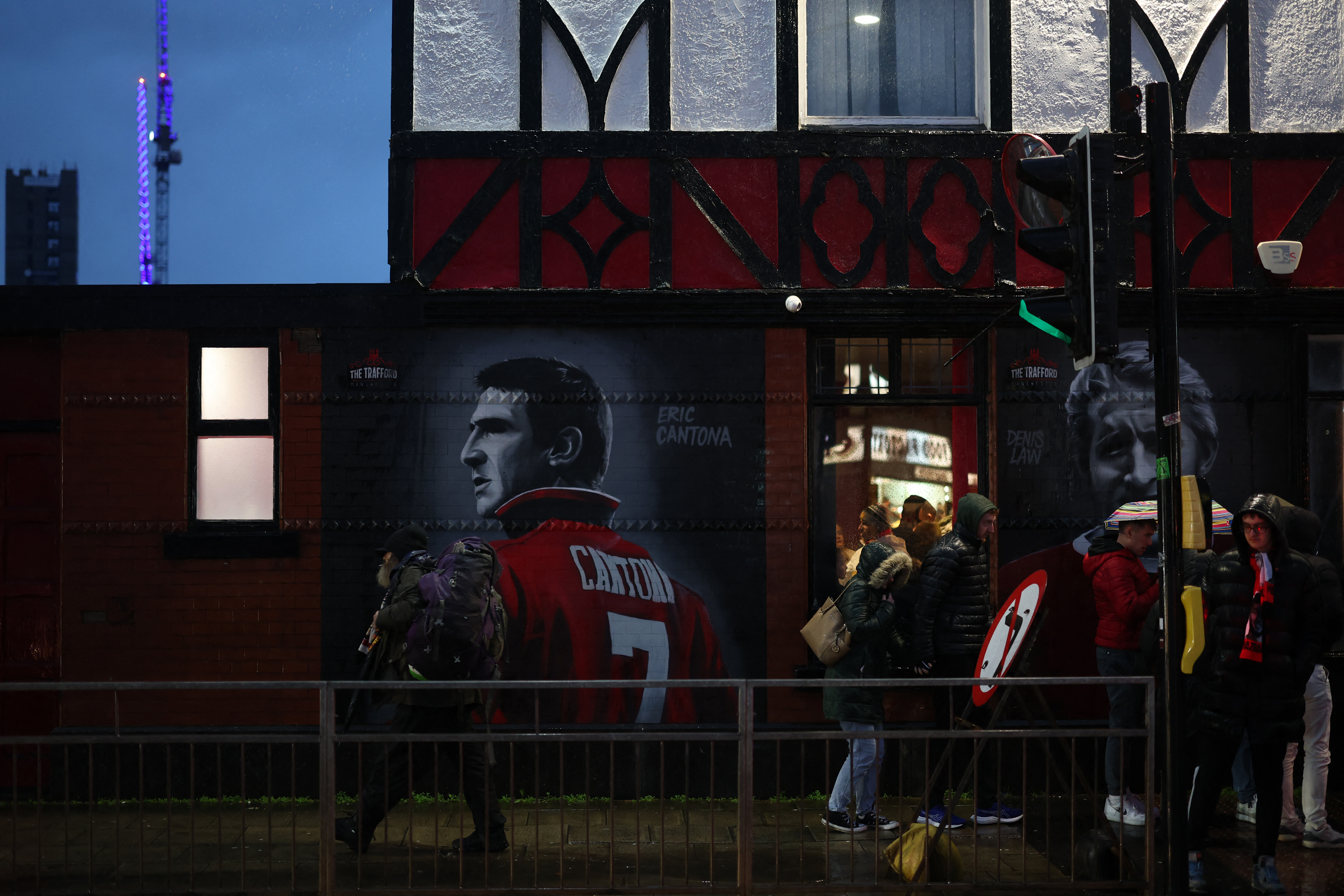 Soccer Football - Premier League - Manchester United v Nottingham Forest - Old Trafford, Manchester, Britain - December 7, 2024 An image of former Manchester United player Eric Cantona is seen outside the stadium before the match Action Images via Reuters/Lee Smith EDITORIAL USE ONLY. NO USE WITH UNAUTHORIZED AUDIO, VIDEO, DATA, FIXTURE LISTS, CLUB/LEAGUE LOGOS OR 'LIVE' SERVICES. ONLINE IN-MATCH USE LIMITED TO 120 IMAGES, NO VIDEO EMULATION. NO USE IN BETTING, GAMES OR SINGLE CLUB/LEAGUE/PLAYER PUBLICATIONS. PLEASE CONTACT YOUR ACCOUNT REPRESENTATIVE FOR FURTHER DETAILS..