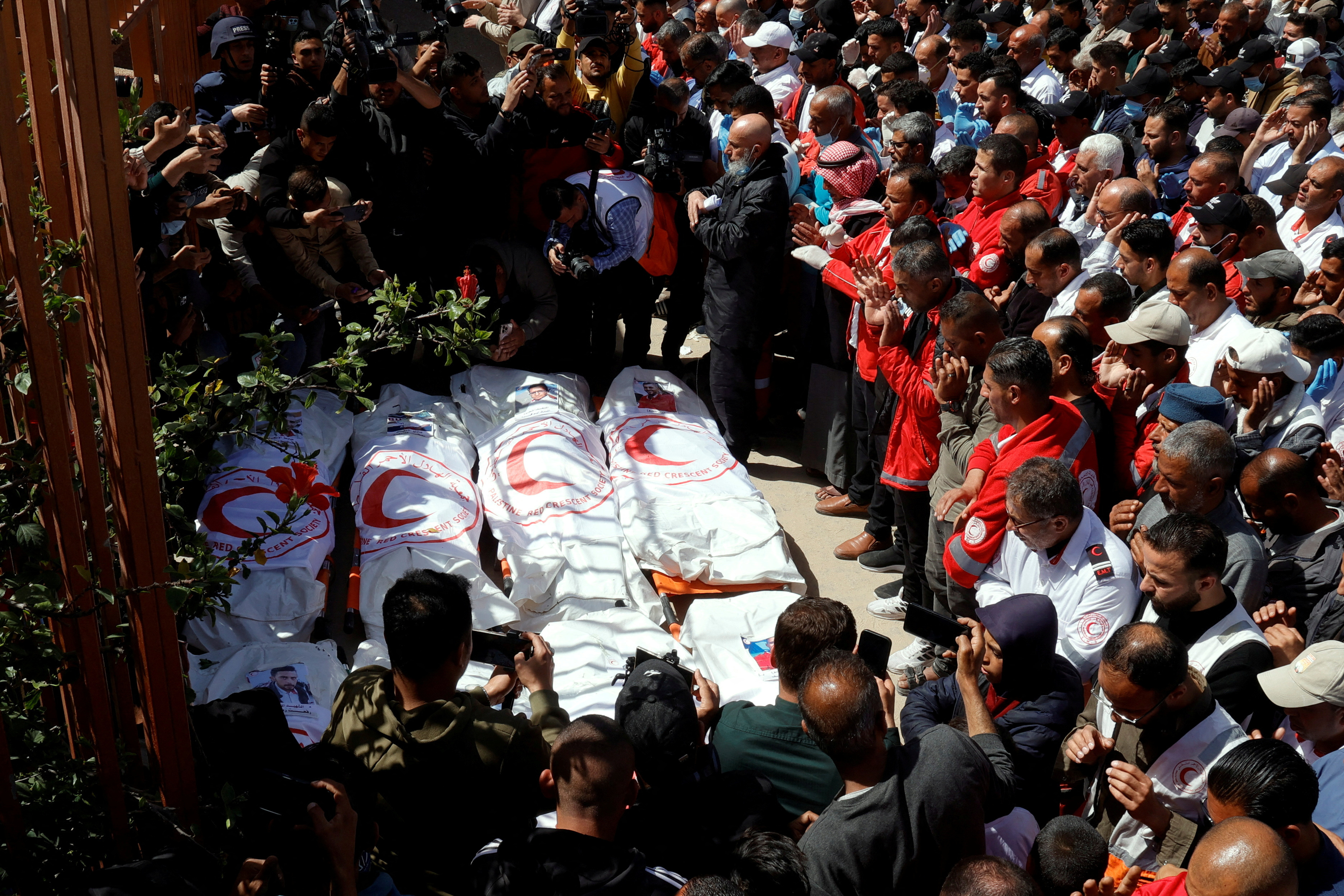 Palestinians mourn medics killed by Israeli forces.
